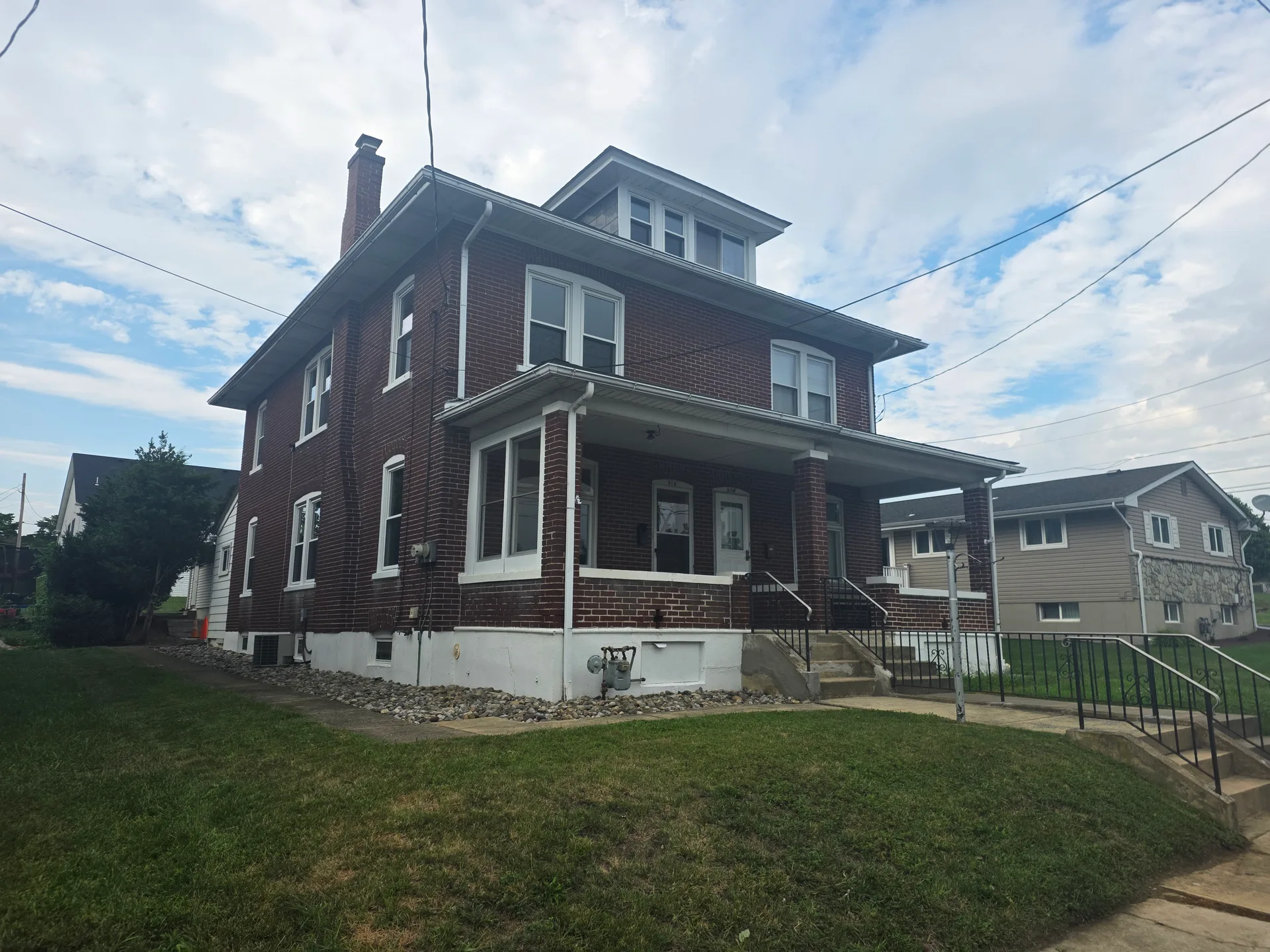 514 Grove Street, Catasauqua PA 18032, front exterior of an all-brick half twin home in North Catasauqua listed by Tim Tepes