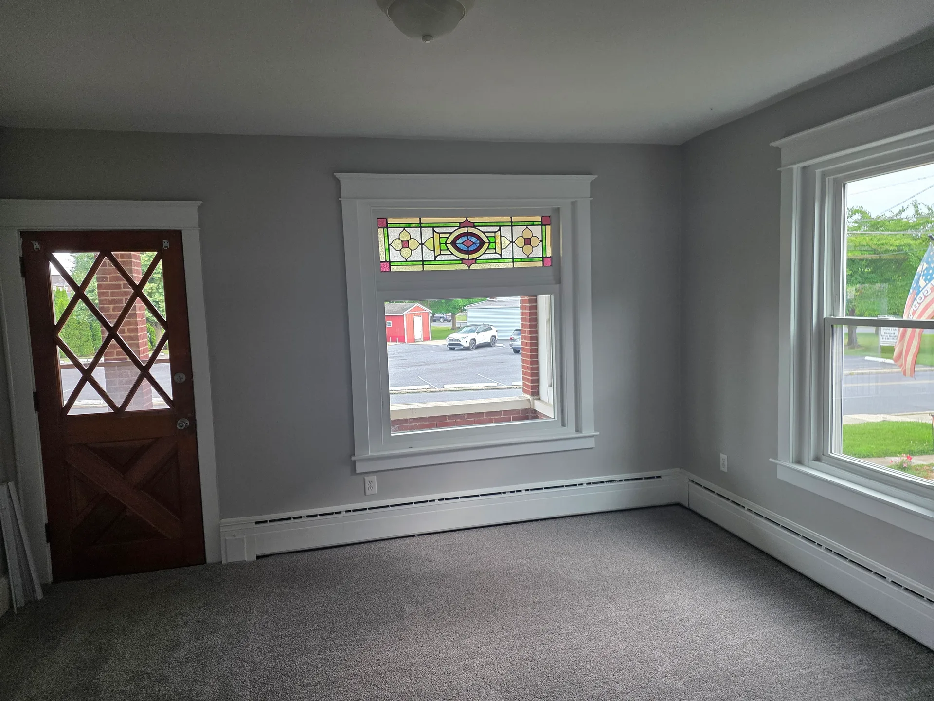 Living room at 514 Grove Street featuring stained-glass transom detail and craftsman woodwork