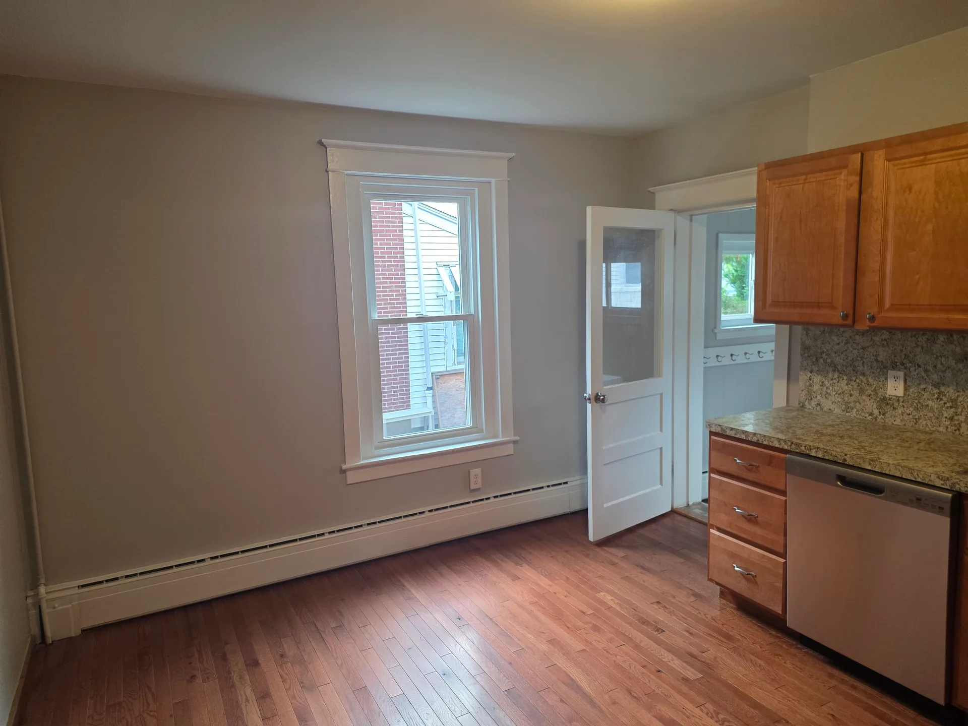 Kitchen looking toward dining and hallway entrance
