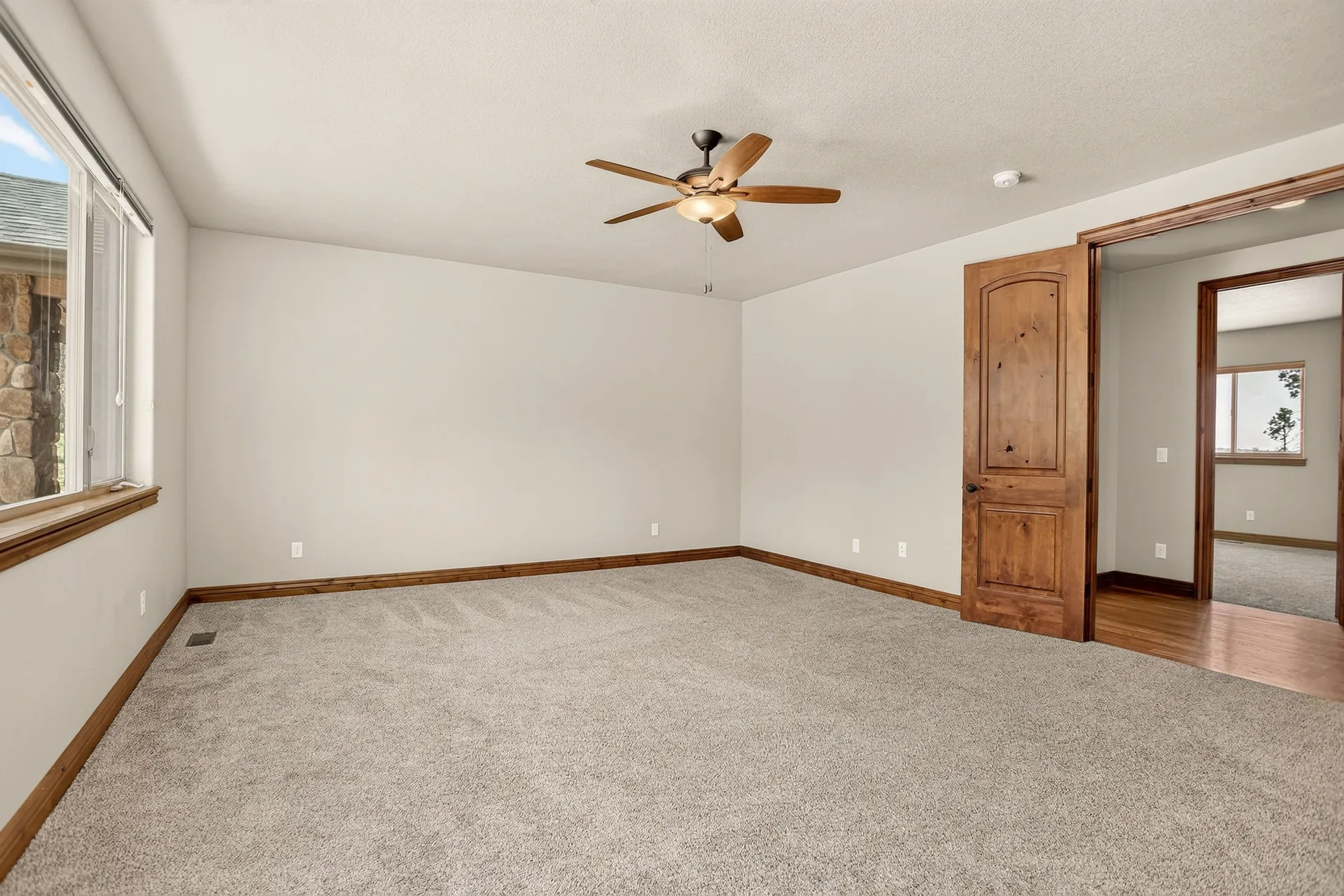 Vacant bedroom with wood door trim
