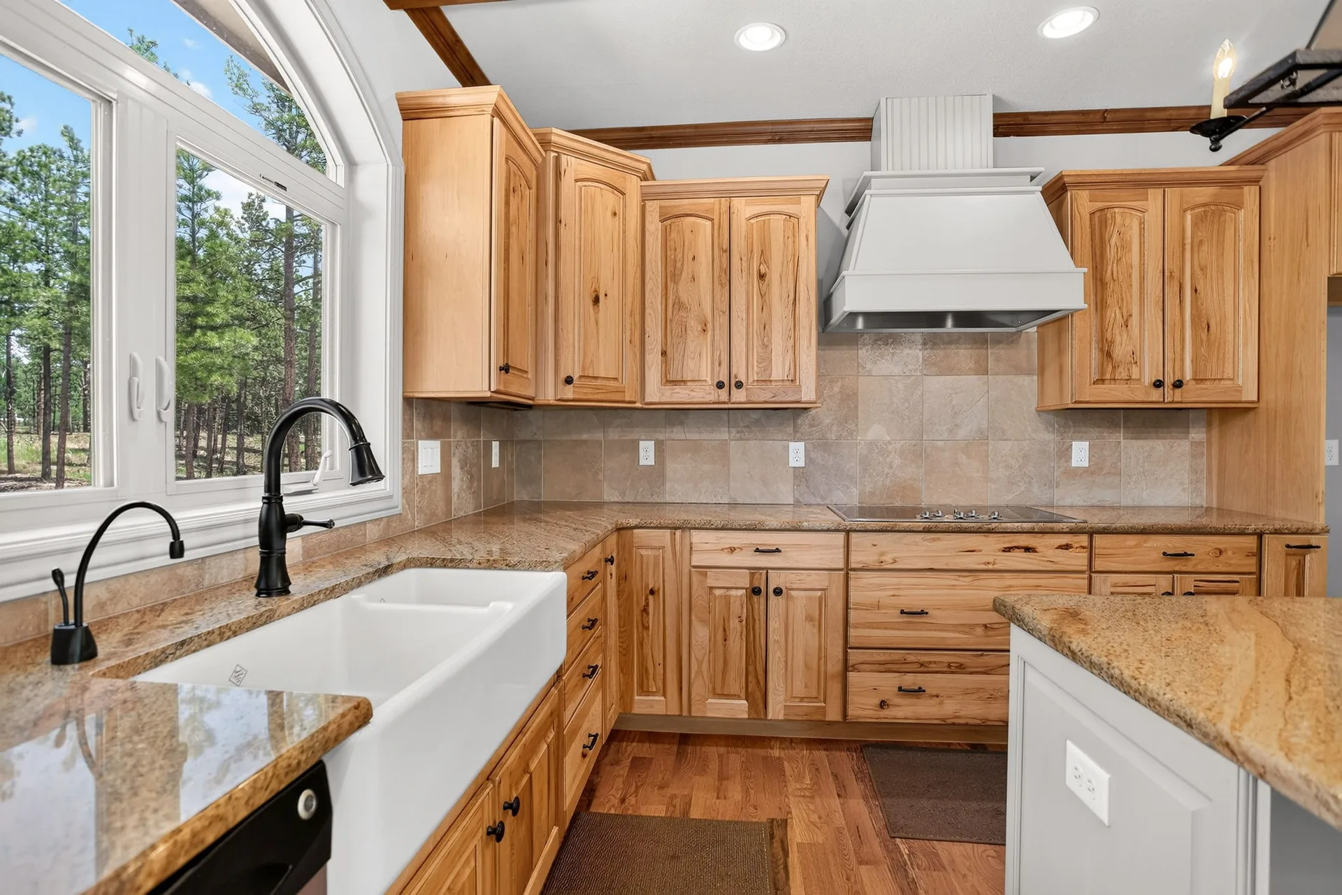 Main kitchen with knotty alder cabinets and granite countertops