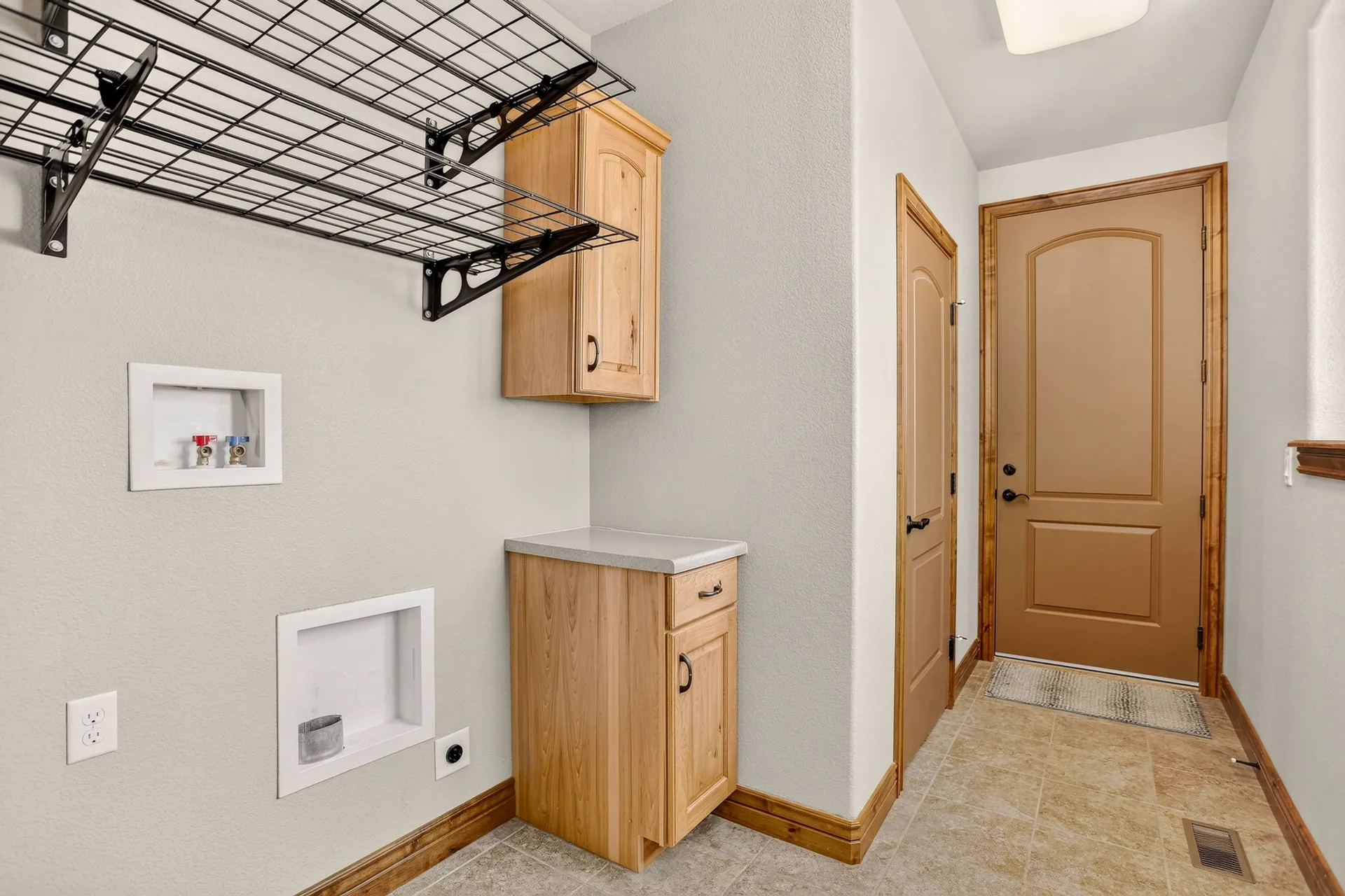 Laundry and mudroom with built-in cabinets