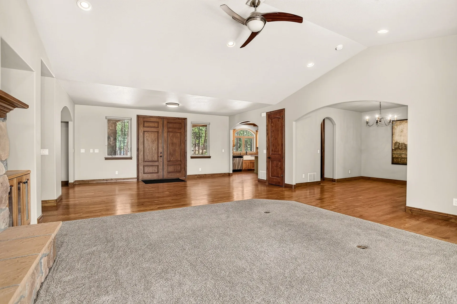 Living room and entryway with arched doorways