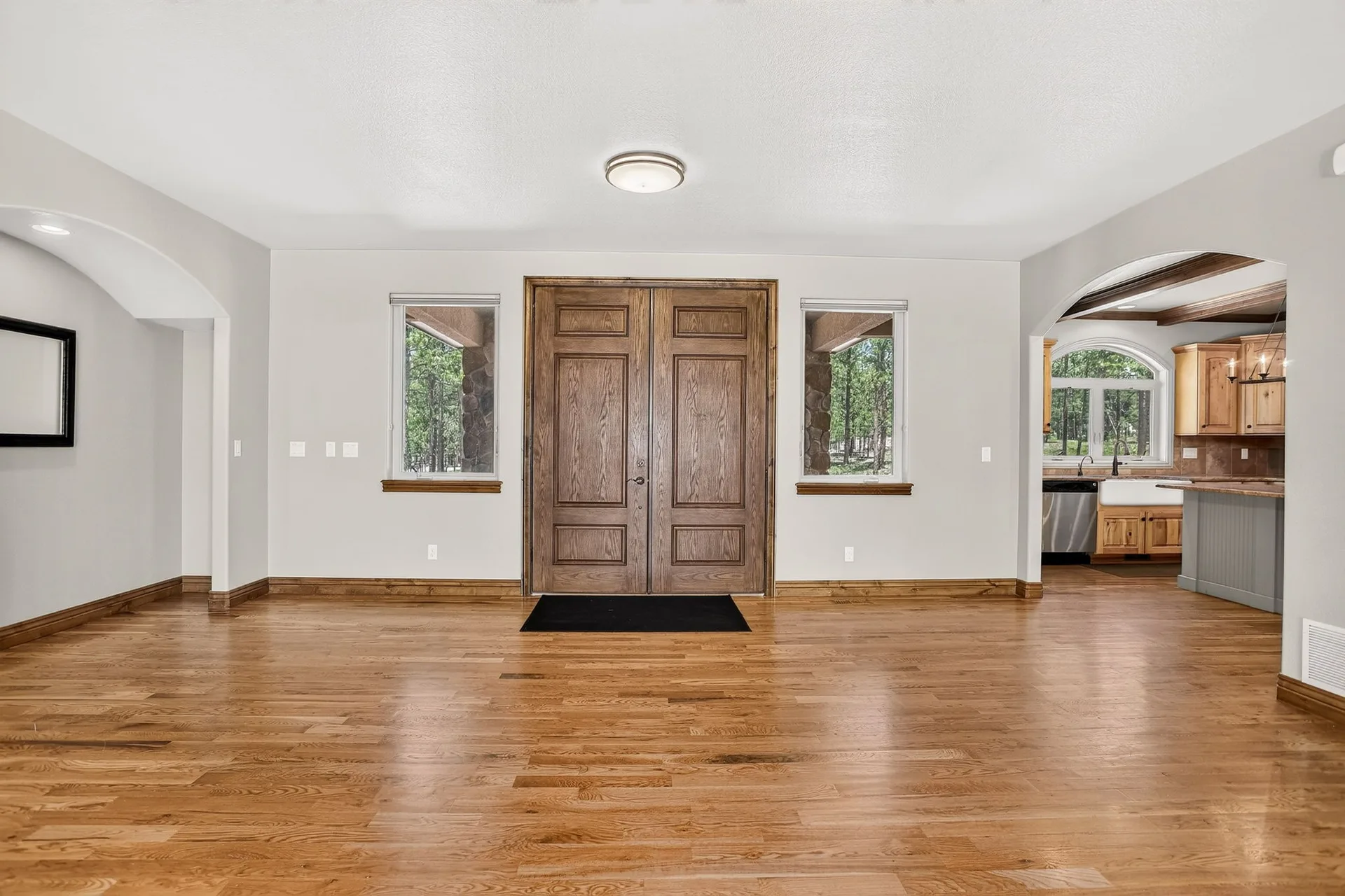 Entryway with stained wood double doors