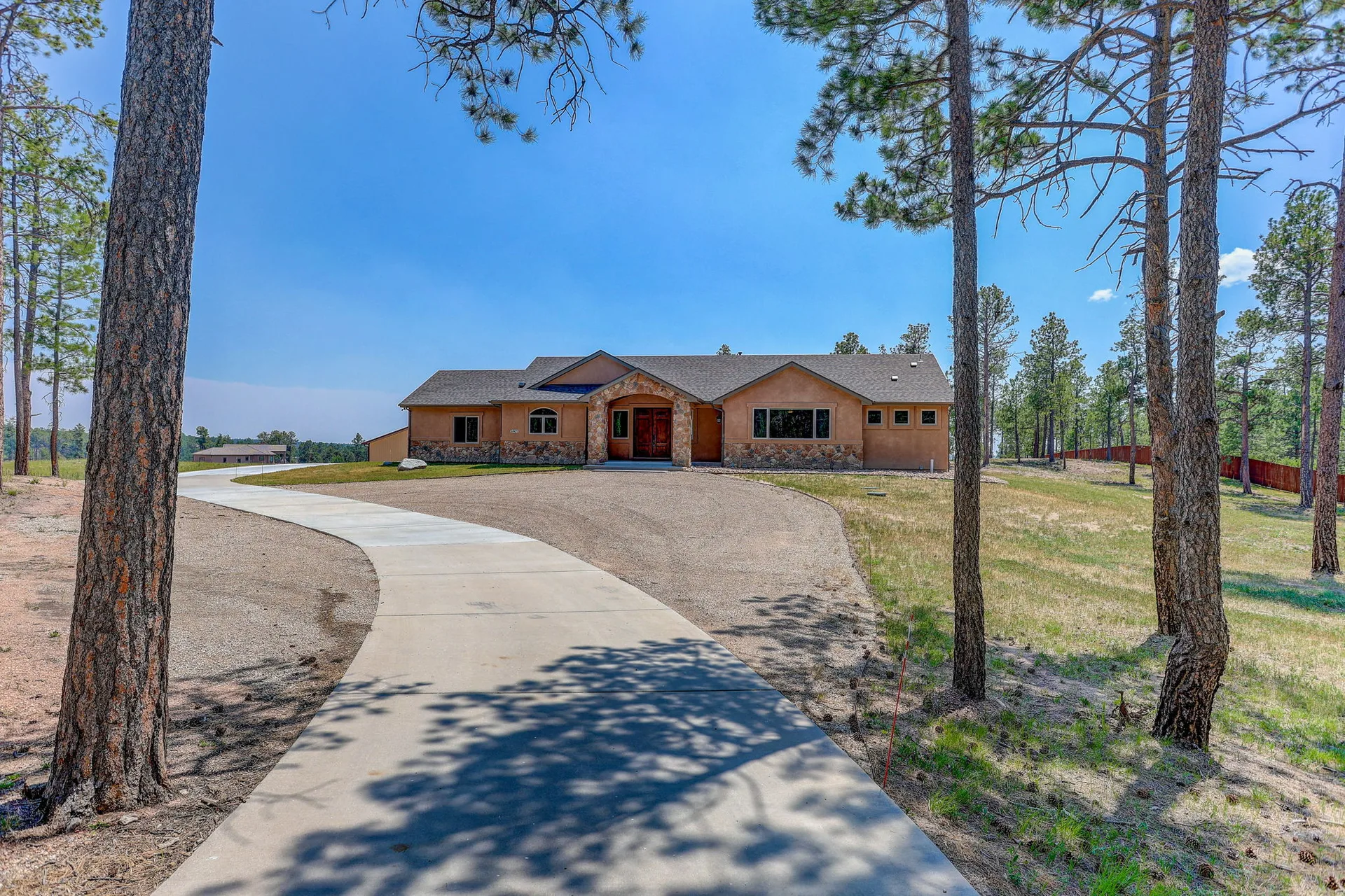 Front facade of the ranch home from the driveway