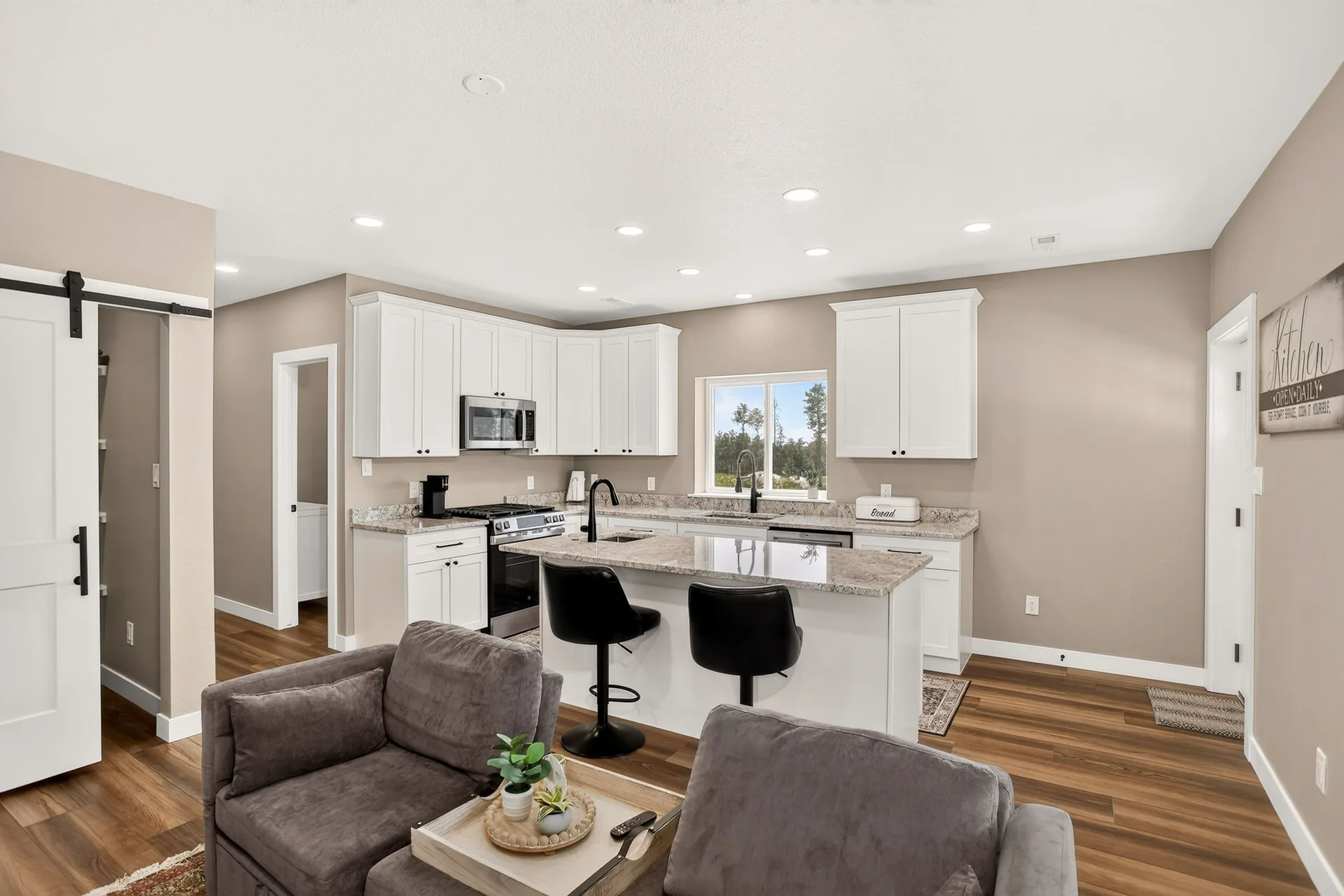 Lower-level kitchen with island and bar seating
