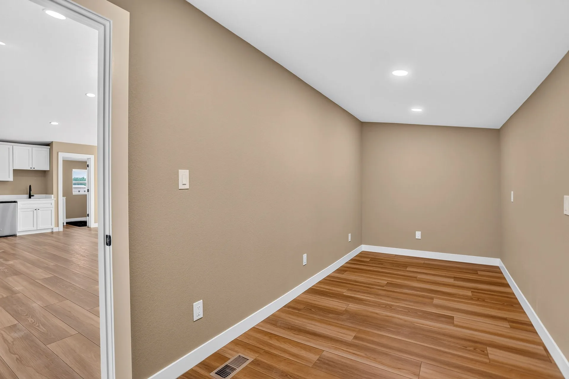 Vacant flex room with plank flooring