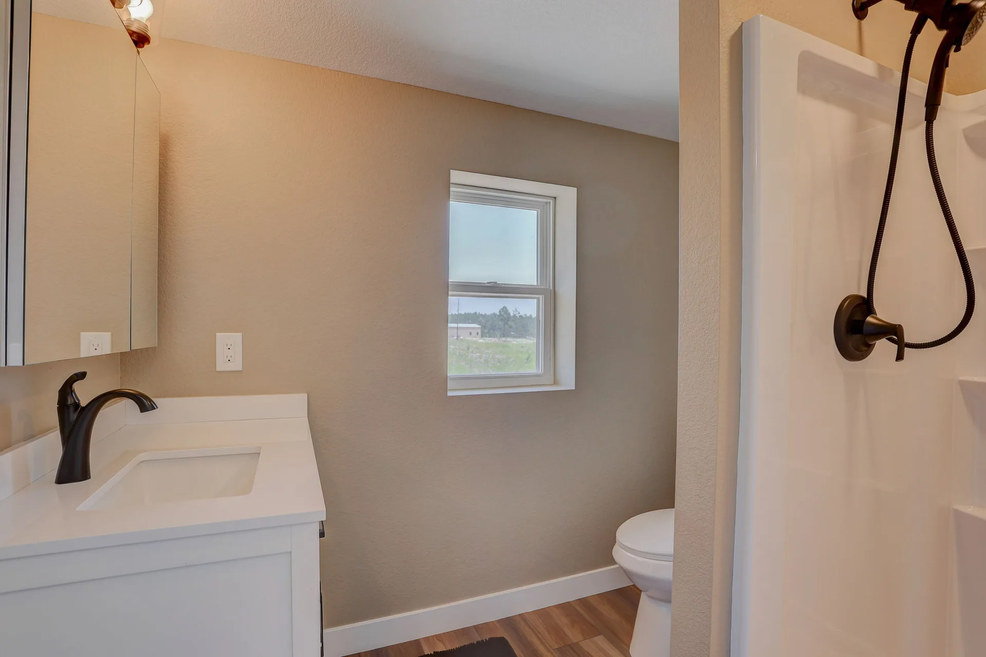 Bathroom with walk-in shower and white vanity