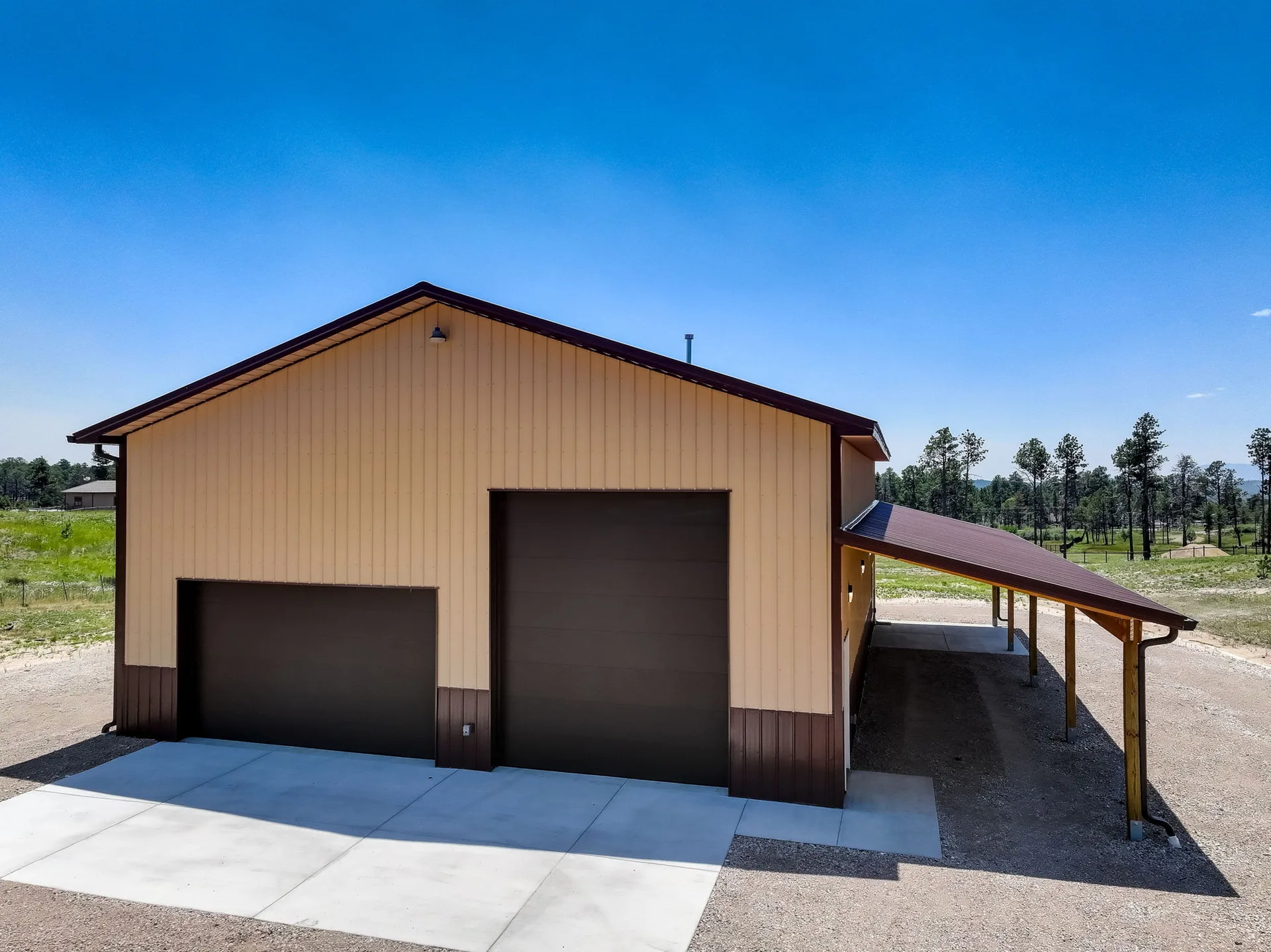 Detached garage/shop with two bays and carport