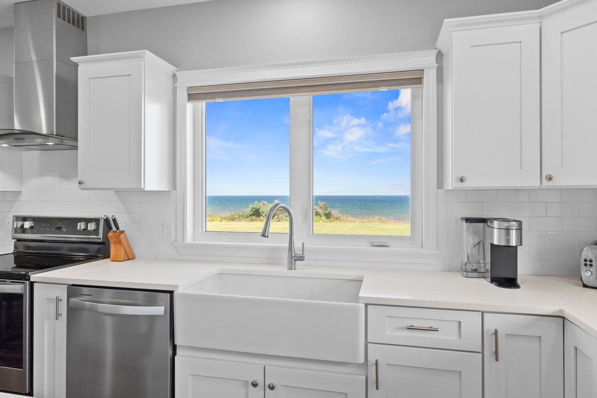 Farmhouse sink area with ocean view