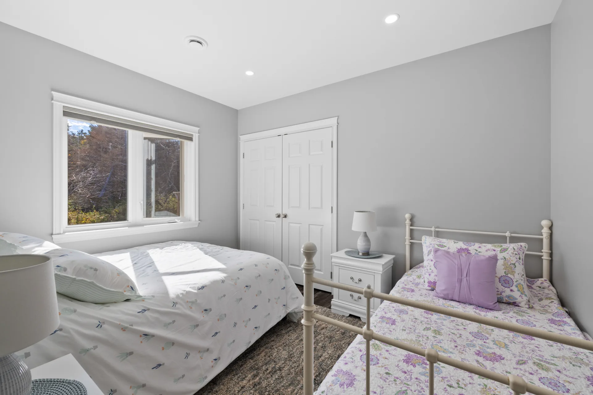 Guest bedroom with two beds and modern styling