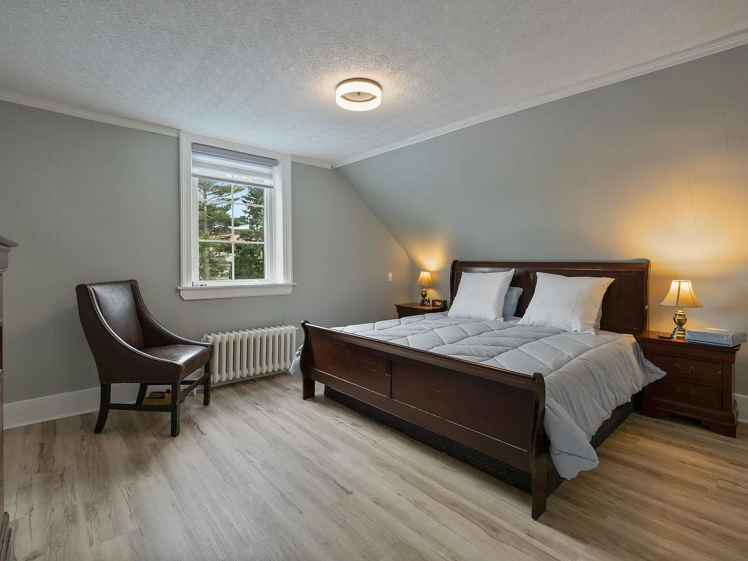 Master bedroom with vaulted ceiling and updated finishes