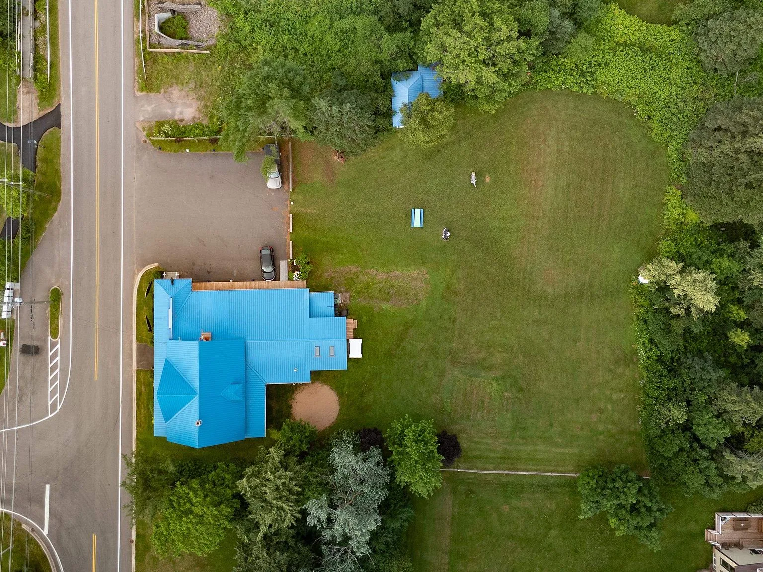 Top-down aerial view of the building and surrounding grounds