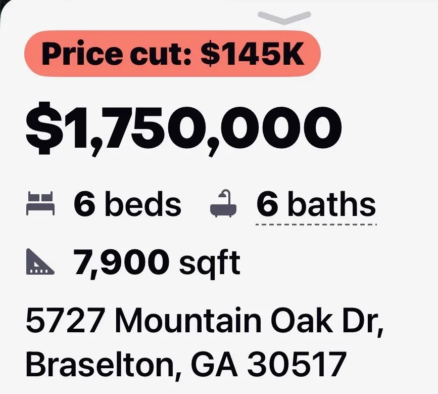 5727 Mountain Oak Dr, a 7,900 sq ft luxury estate now priced at $1,750,000 in the Woodlands section of Chateau Elan, Braselton Georgia