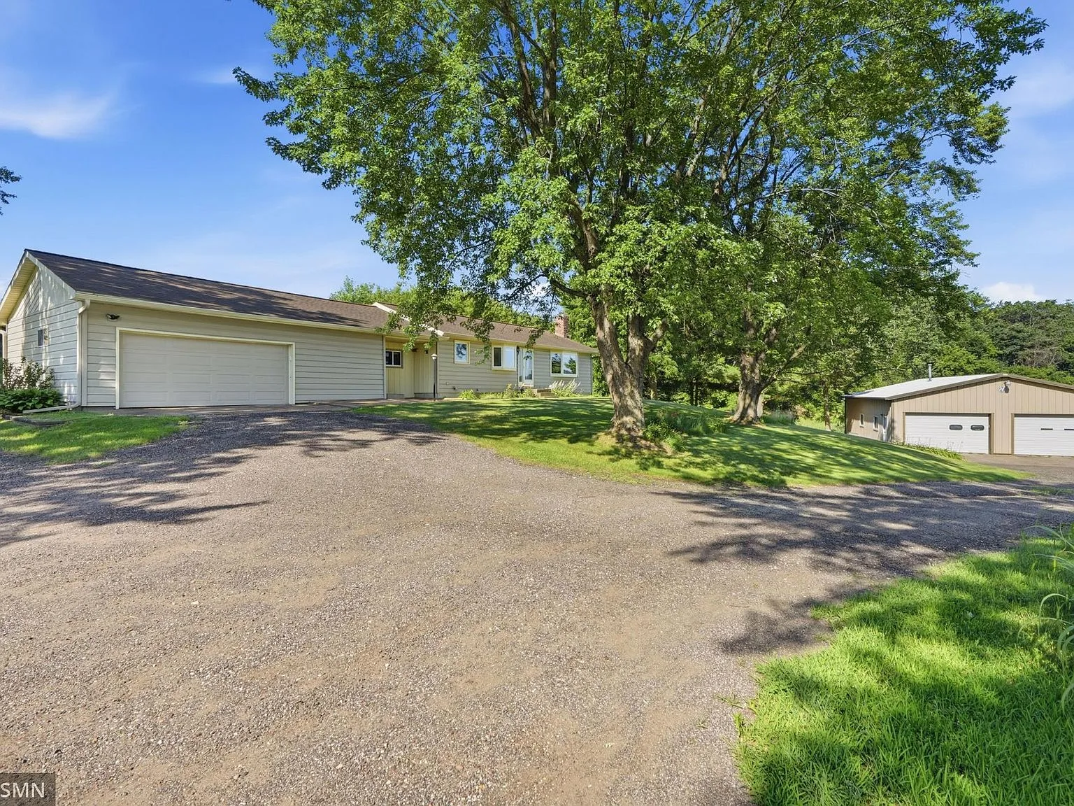 Country home with sheds on a 5-acre property near Mondovi, Wisconsin