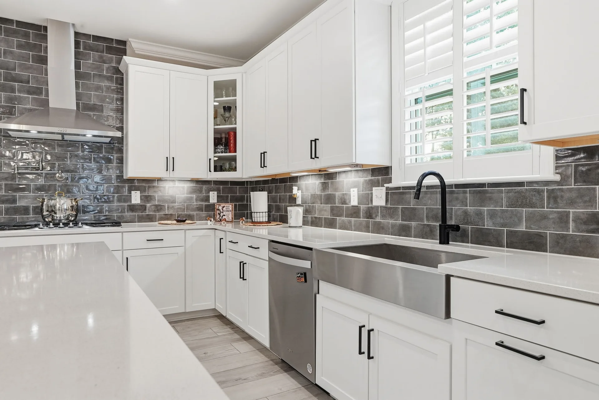 Farmhouse kitchen with apron-front sink and matte black hardware