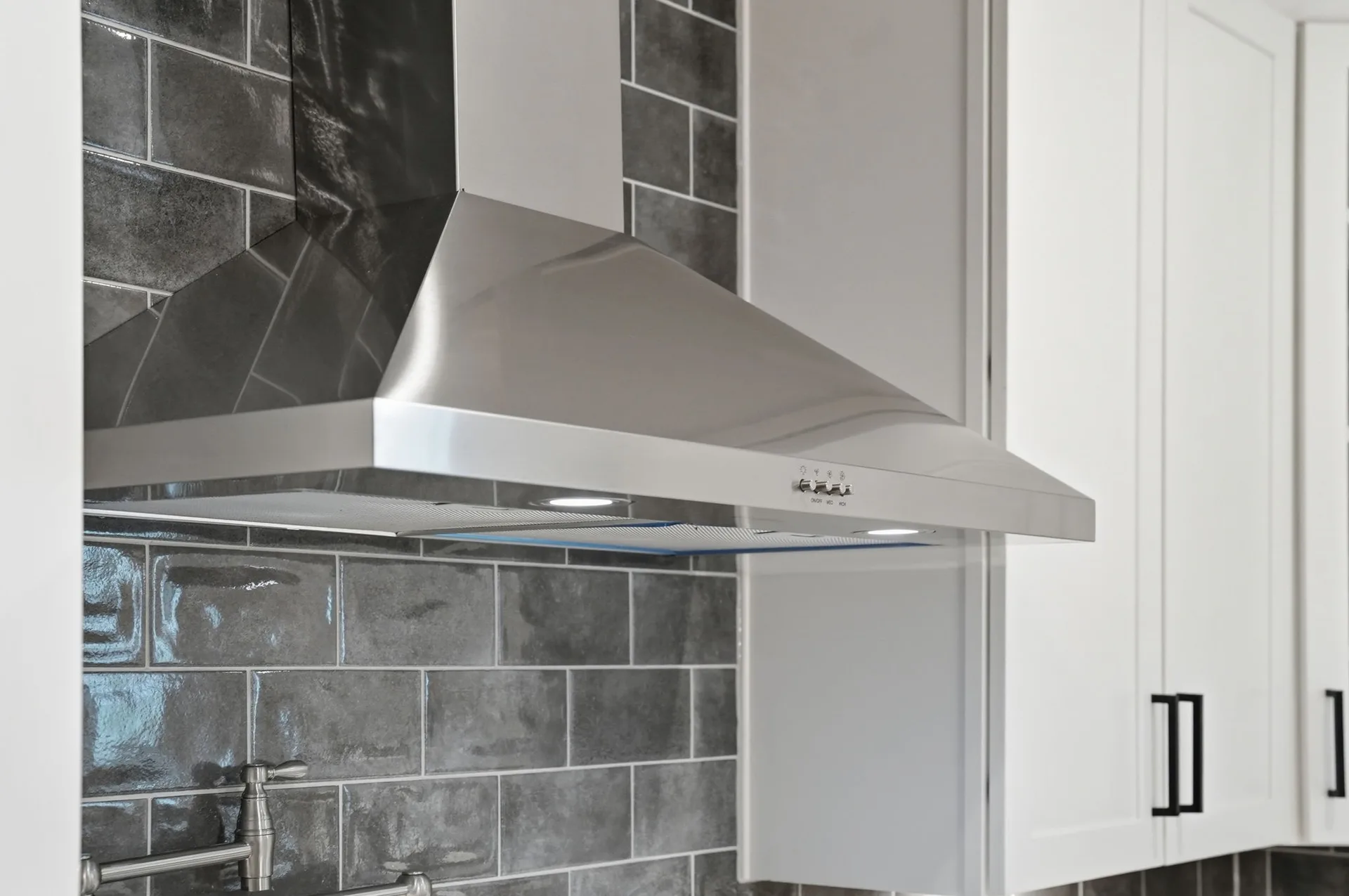 Stainless steel range hood with pot filler faucet