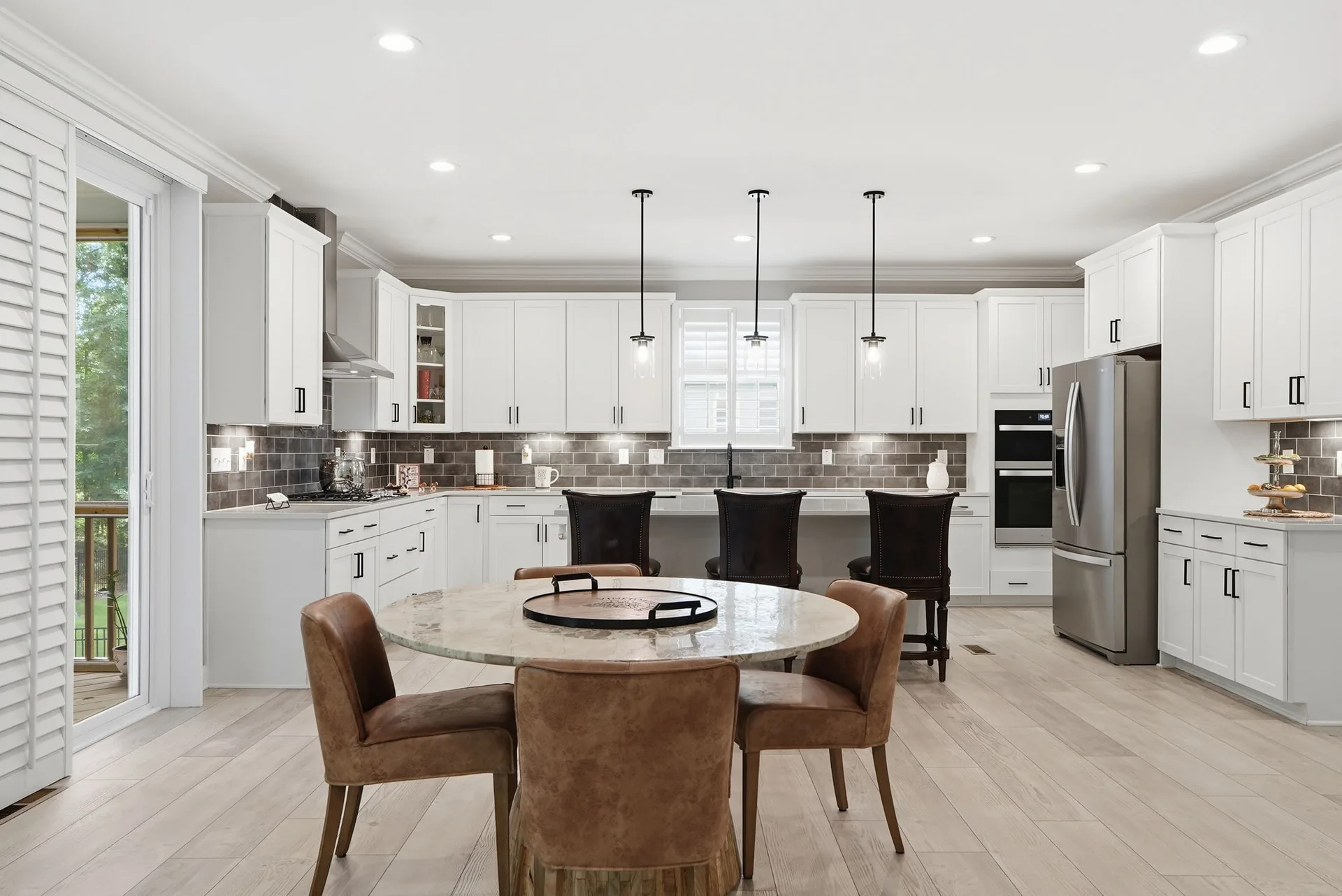 Kitchen and dining area with stainless appliances