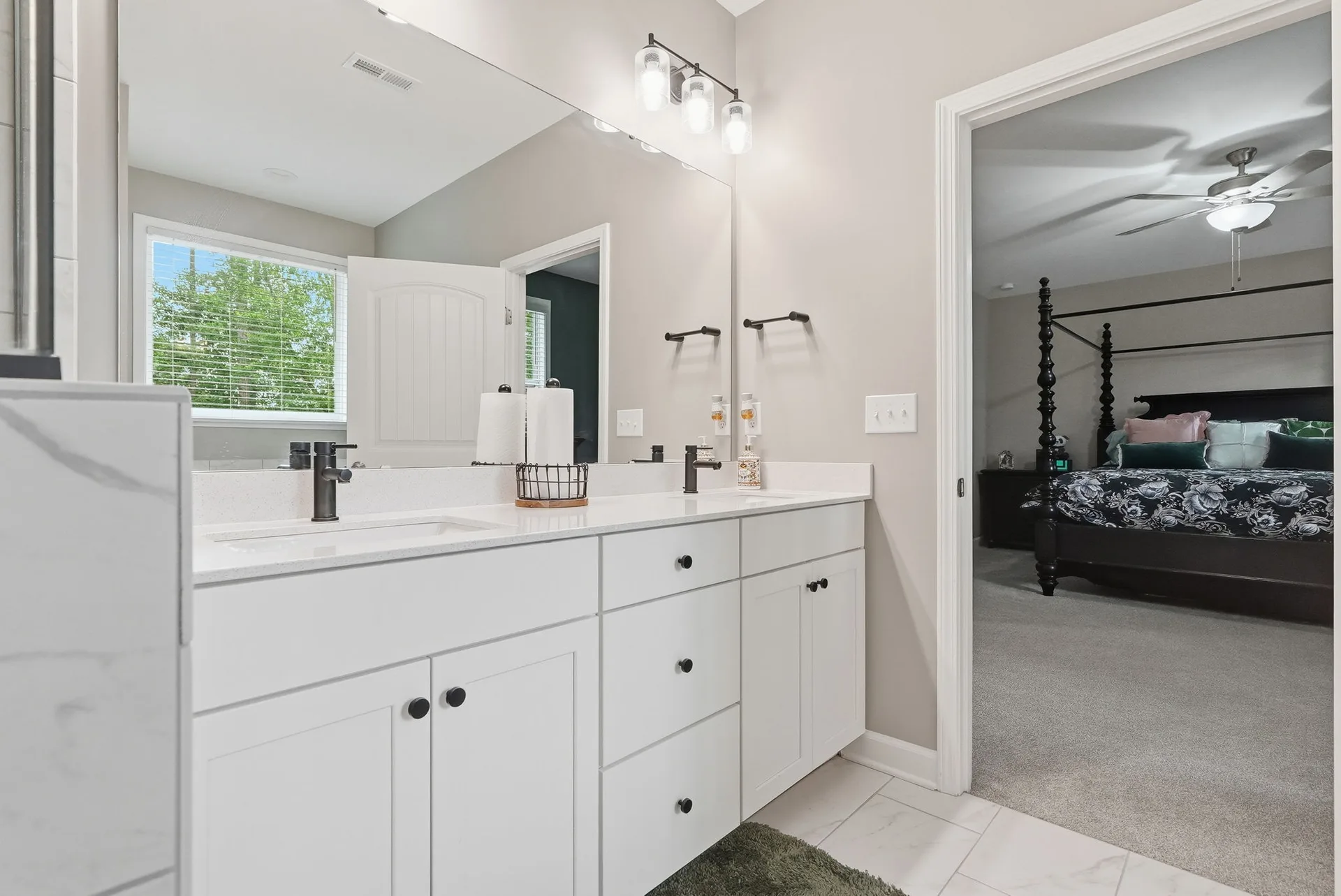 Primary bathroom vanity with matte black hardware