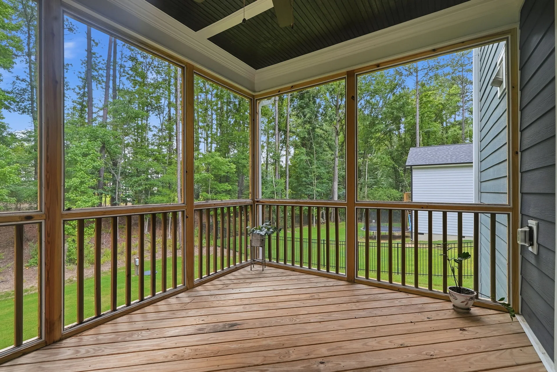 Screened-in back porch overlooking the yard