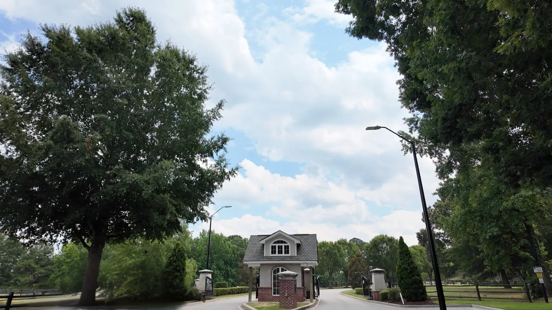 Gated community entrance with guardhouse