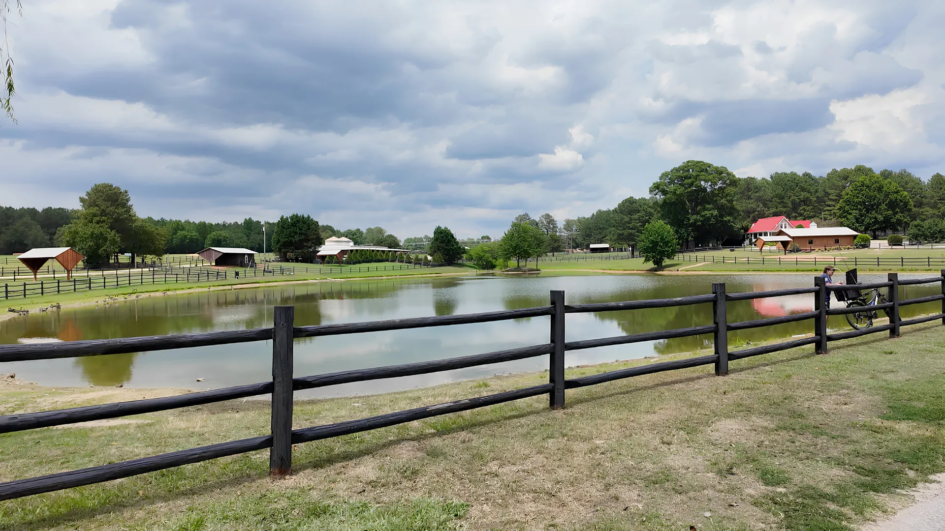 Pond view with split-rail fencing