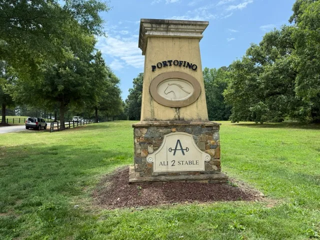 Portofino community monument sign with horse emblem