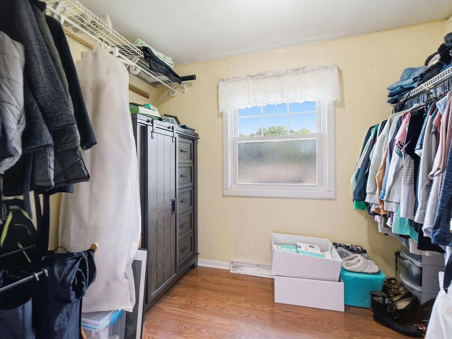 Walk-in closet with shelving and storage