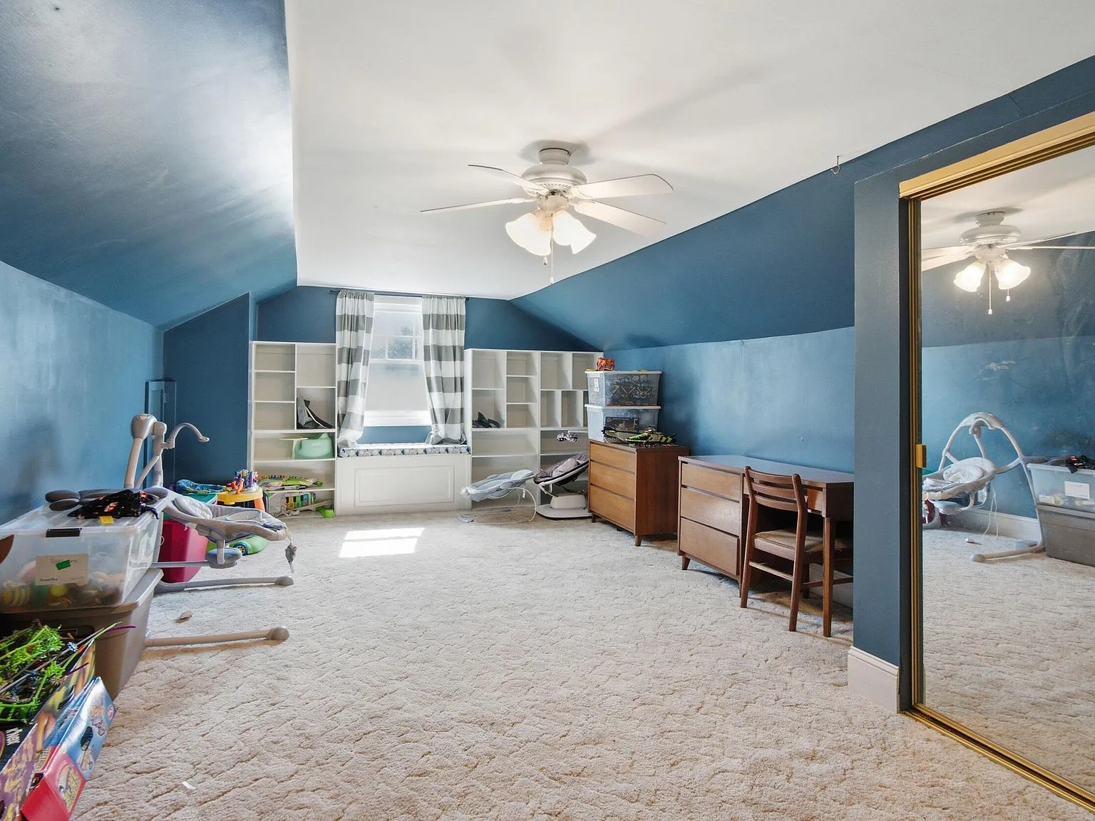 Bedroom with vaulted ceilings painted dark blue