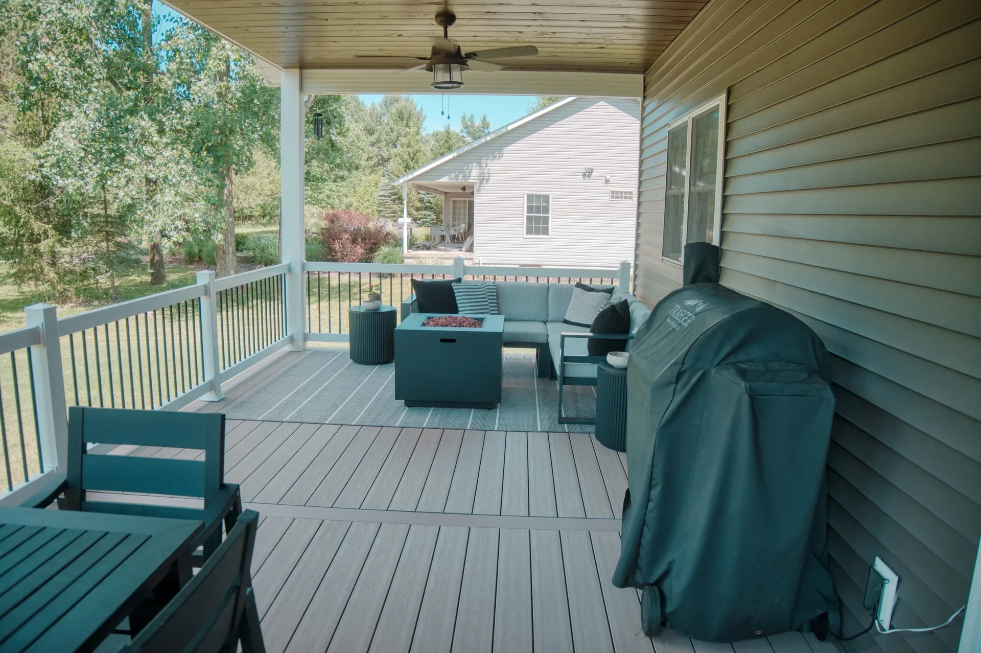 Covered maintenance-free composite deck overlooking the backyard