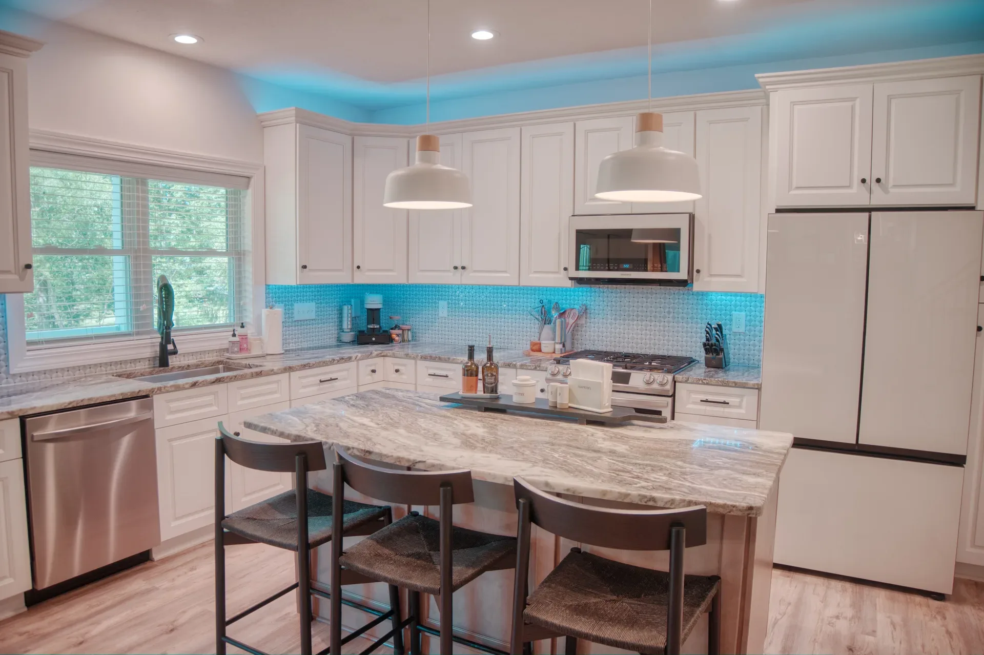 Modern kitchen with granite countertops and white shaker cabinets