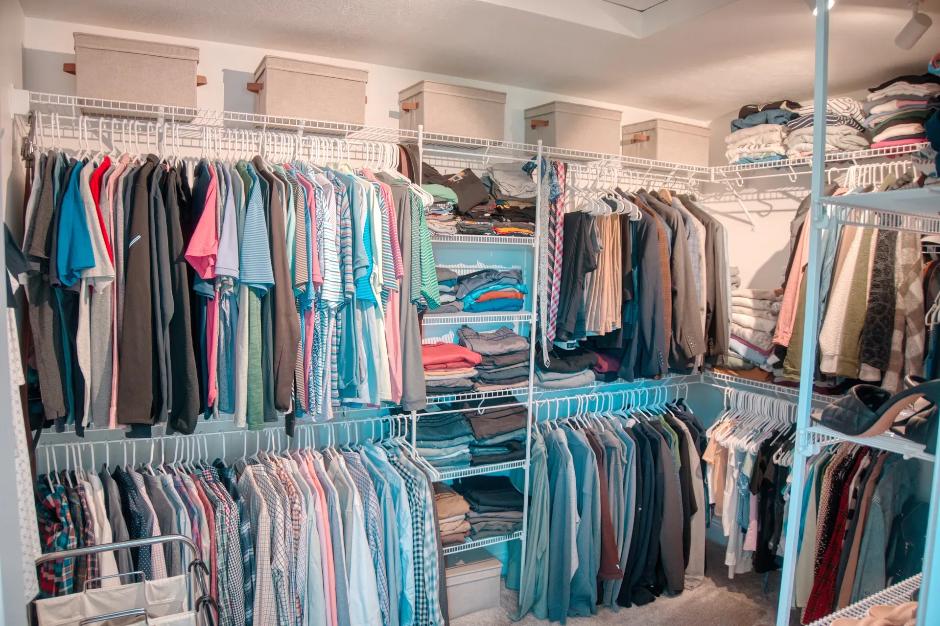 Walk-in closet with white wire shelving system