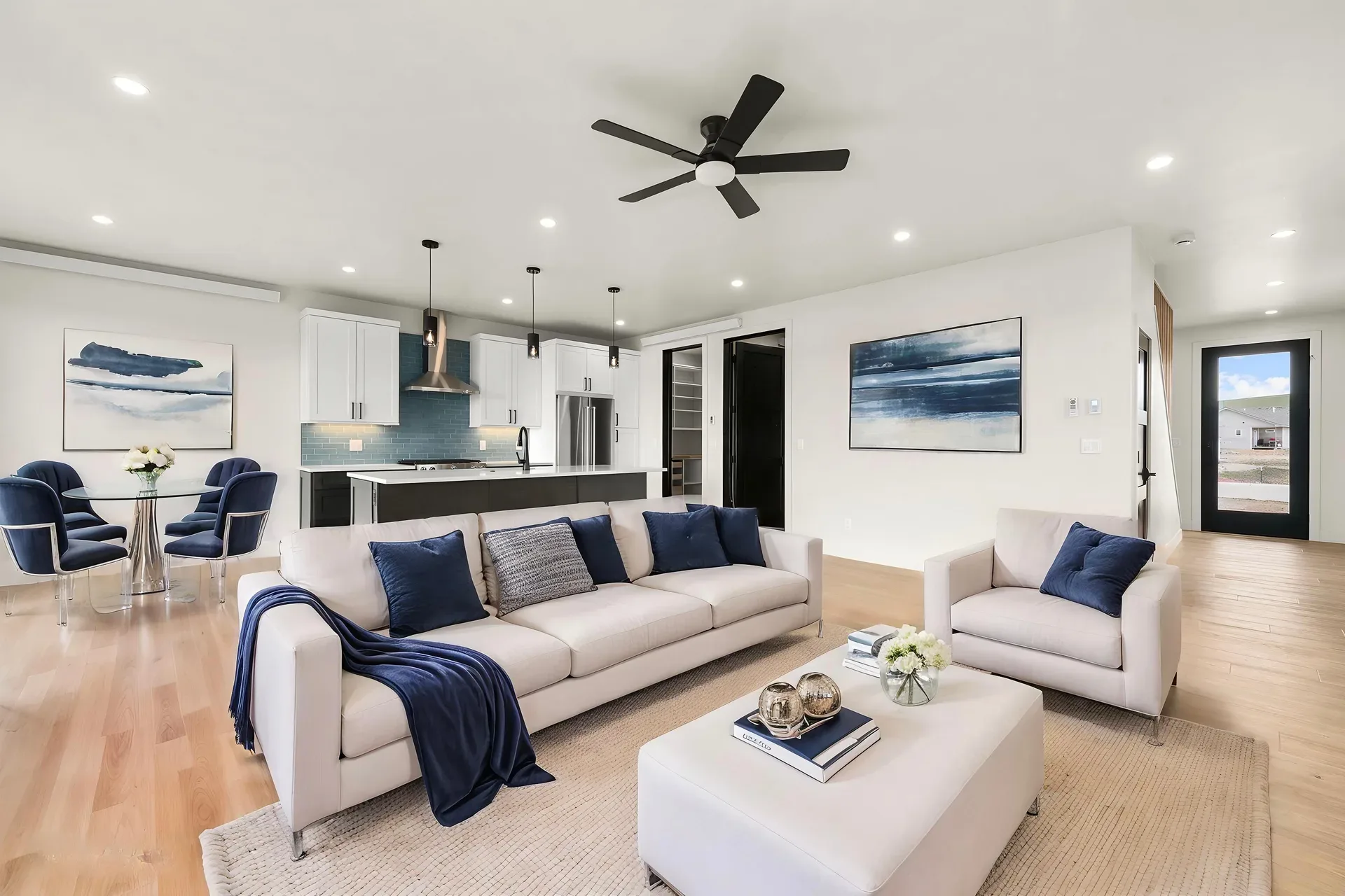 Open-concept living area with kitchen in background