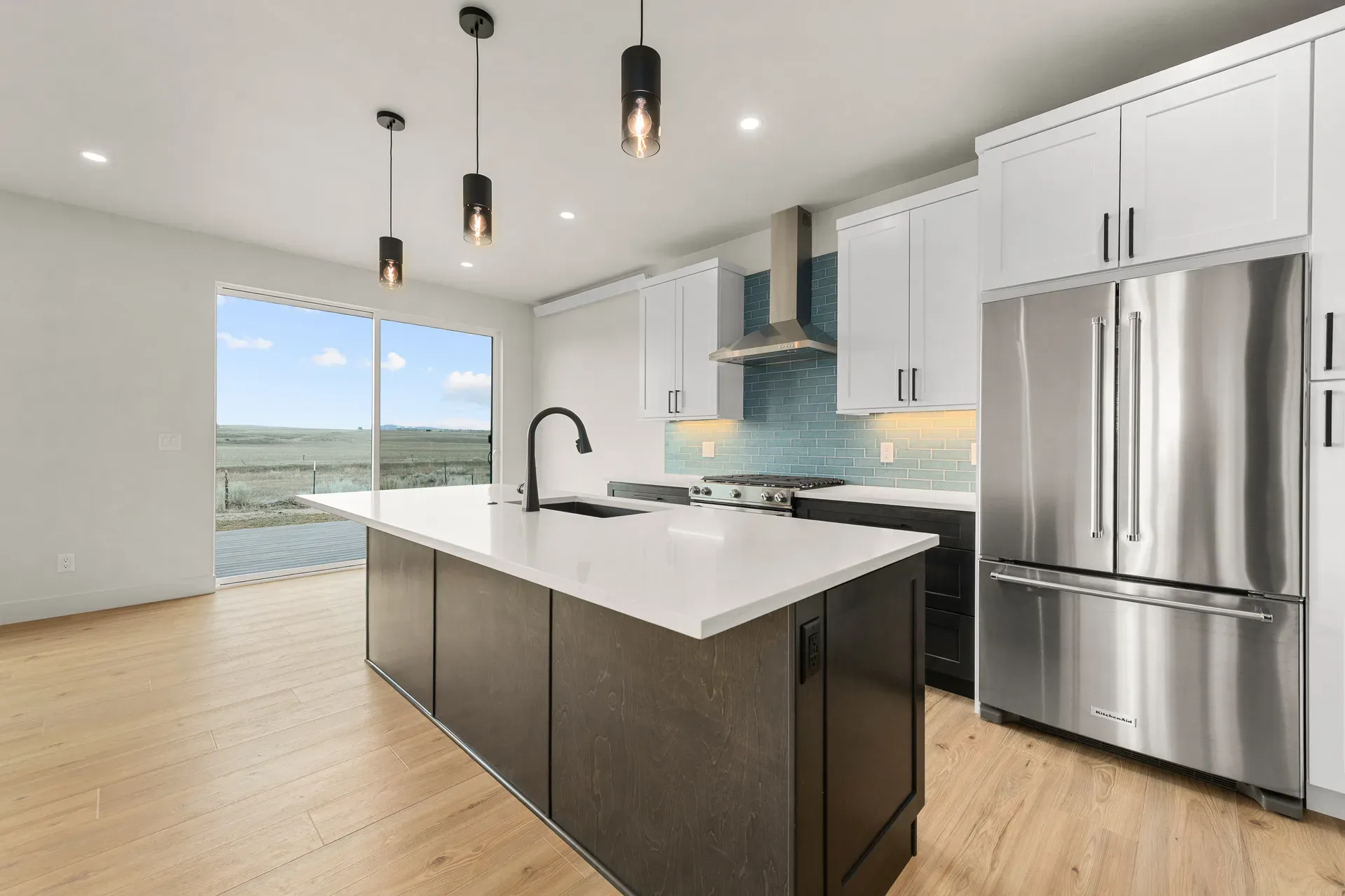 Contemporary kitchen island with pendant lighting