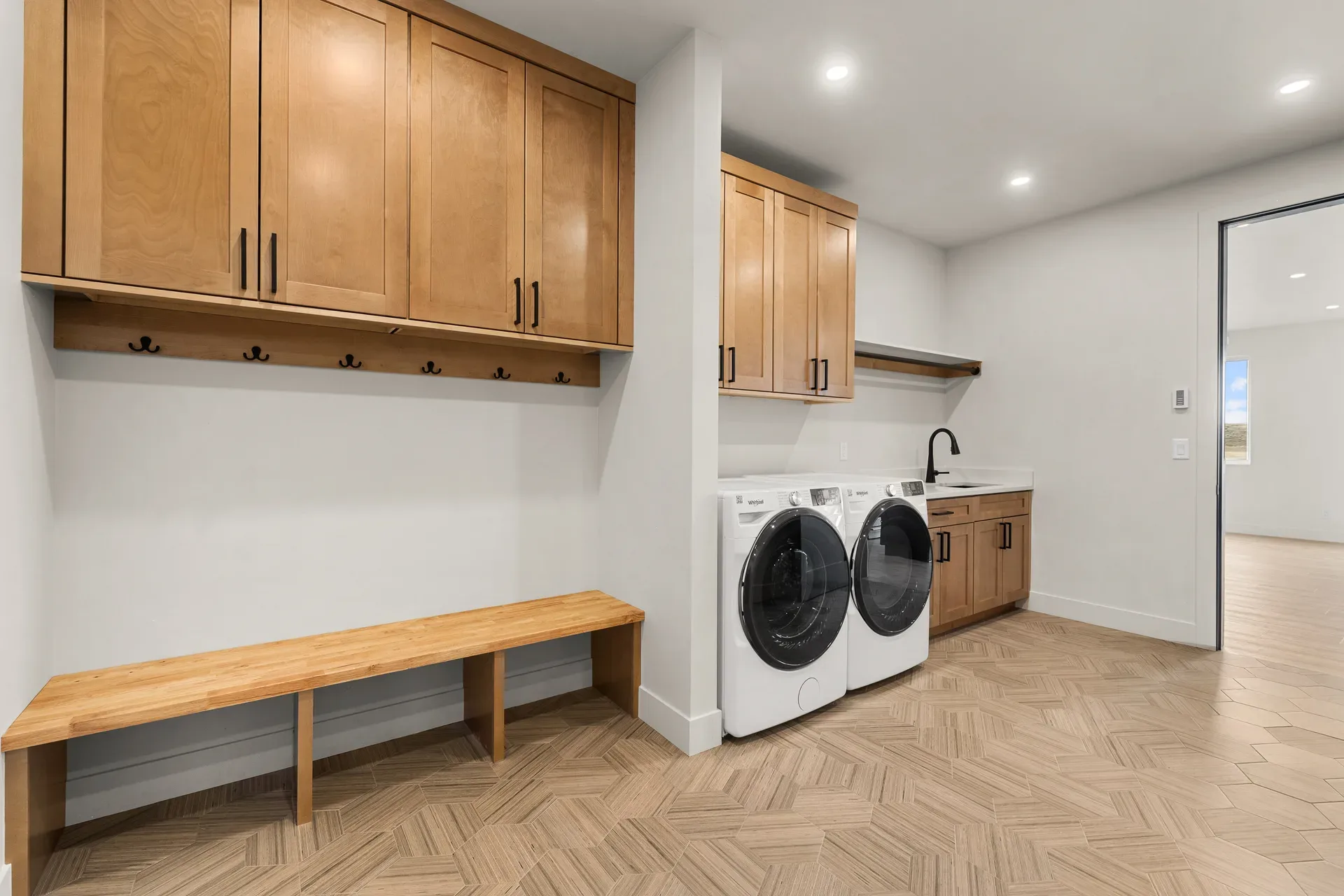 Mudroom and laundry area with built-in storage