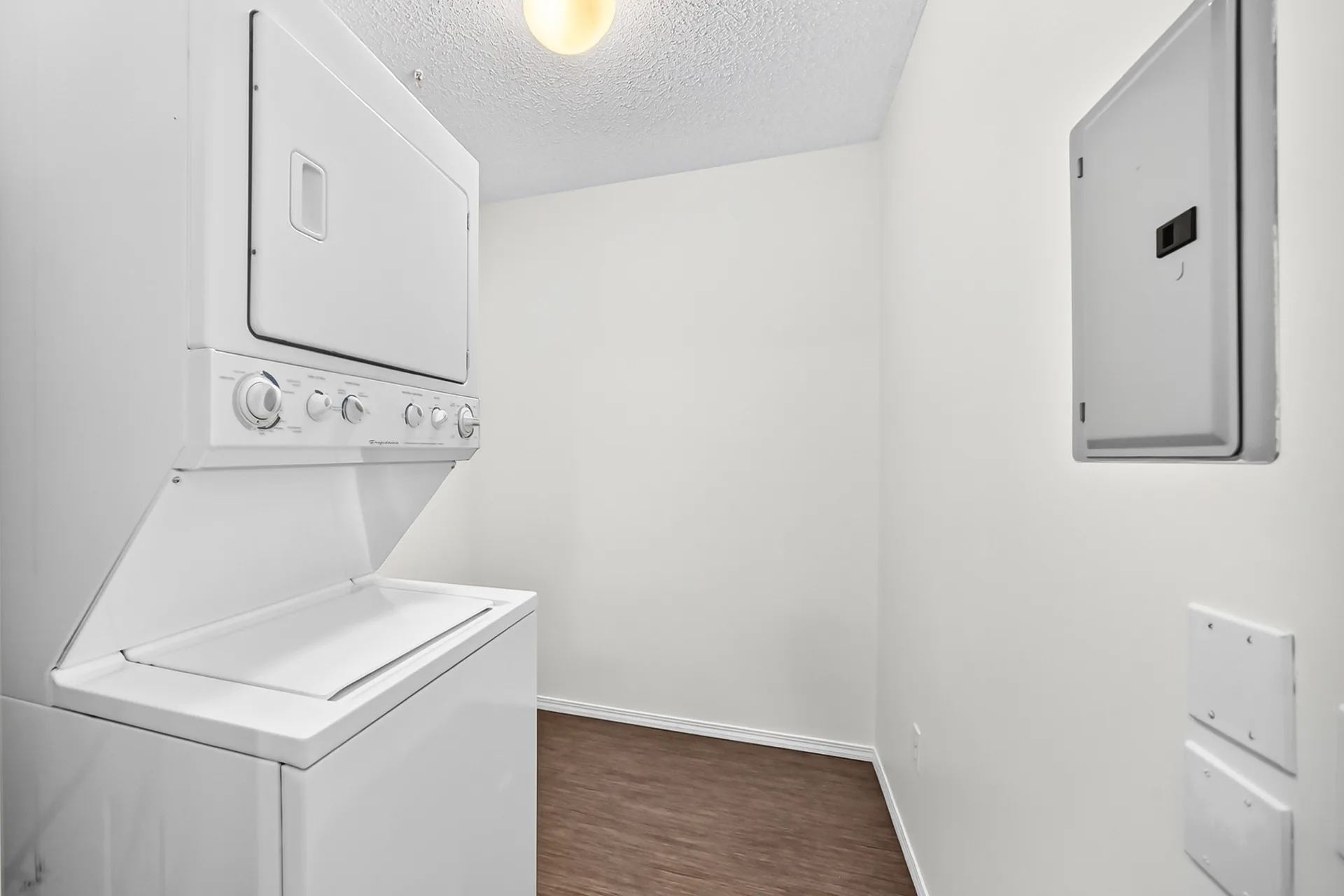 In-suite laundry room with stackable washer-dryer