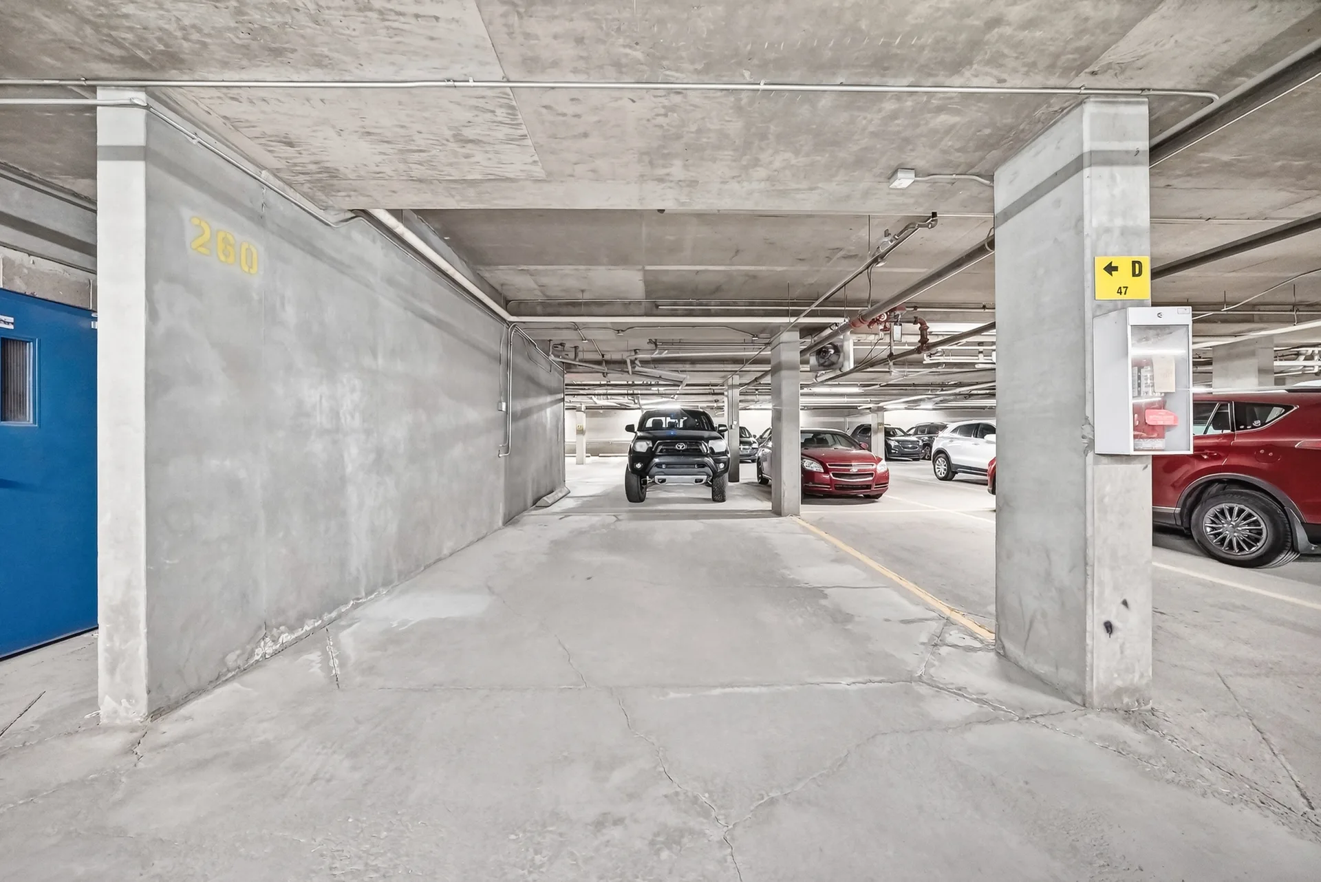 Titled underground parking space marked 209