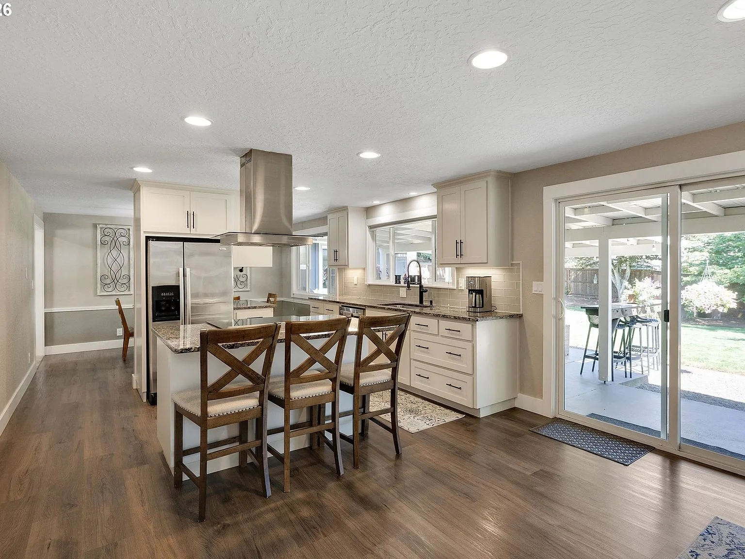 Kitchen view toward sliding glass doors to the backyard