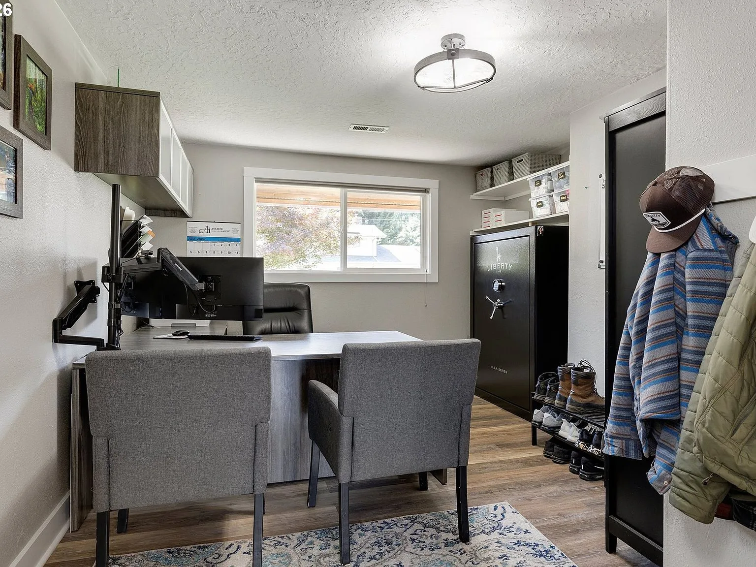 Dedicated home office with natural light and wood-look flooring