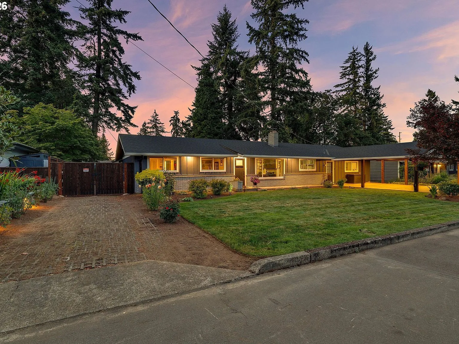 Exterior facade at sunset with house lights illuminated