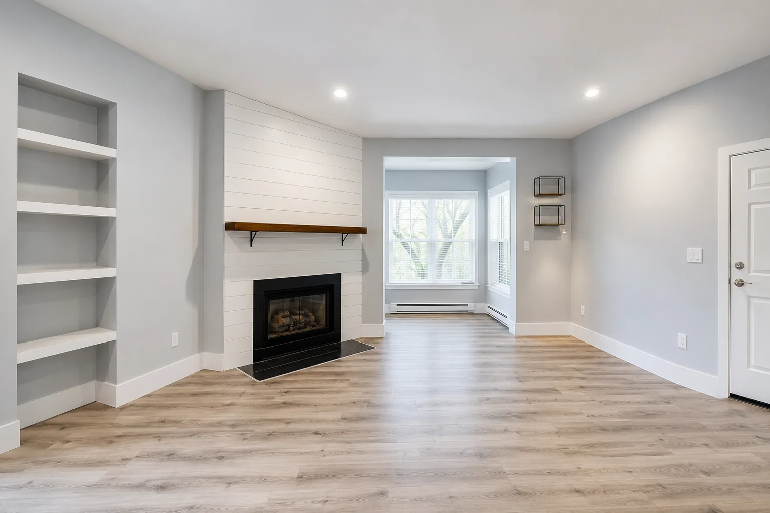 Living room with fireplace and white shiplap surround