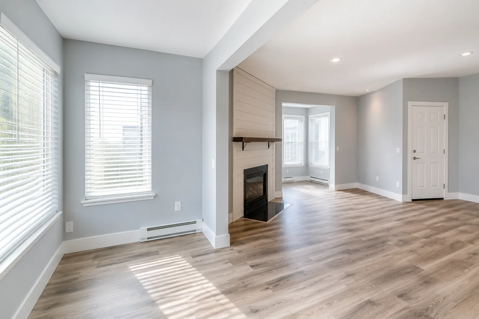 Living room wide-angle showing multiple windows