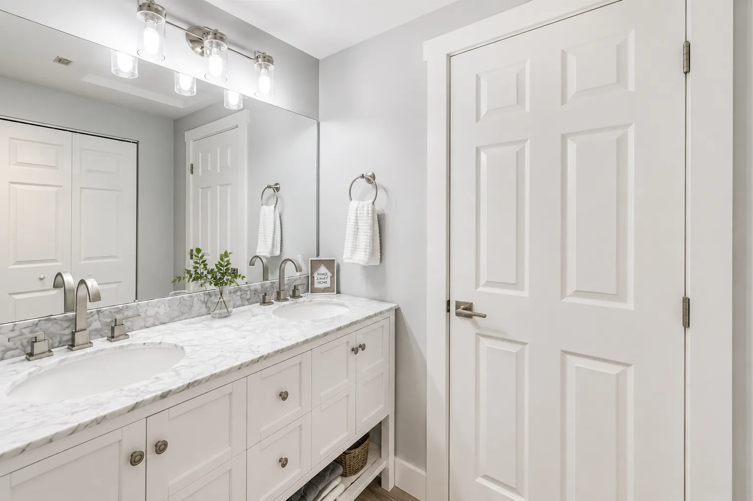 Modern bathroom with dual-sink vanity and marble countertop