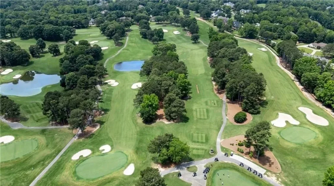 Aerial view of golf fairways and homes in the Chateau Elan community Braselton Georgia