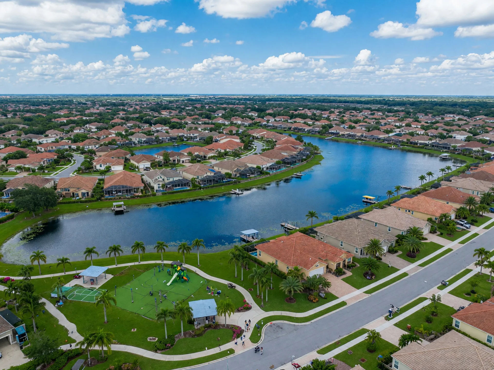 Family-friendly suburban Florida neighborhood with lake and palm trees