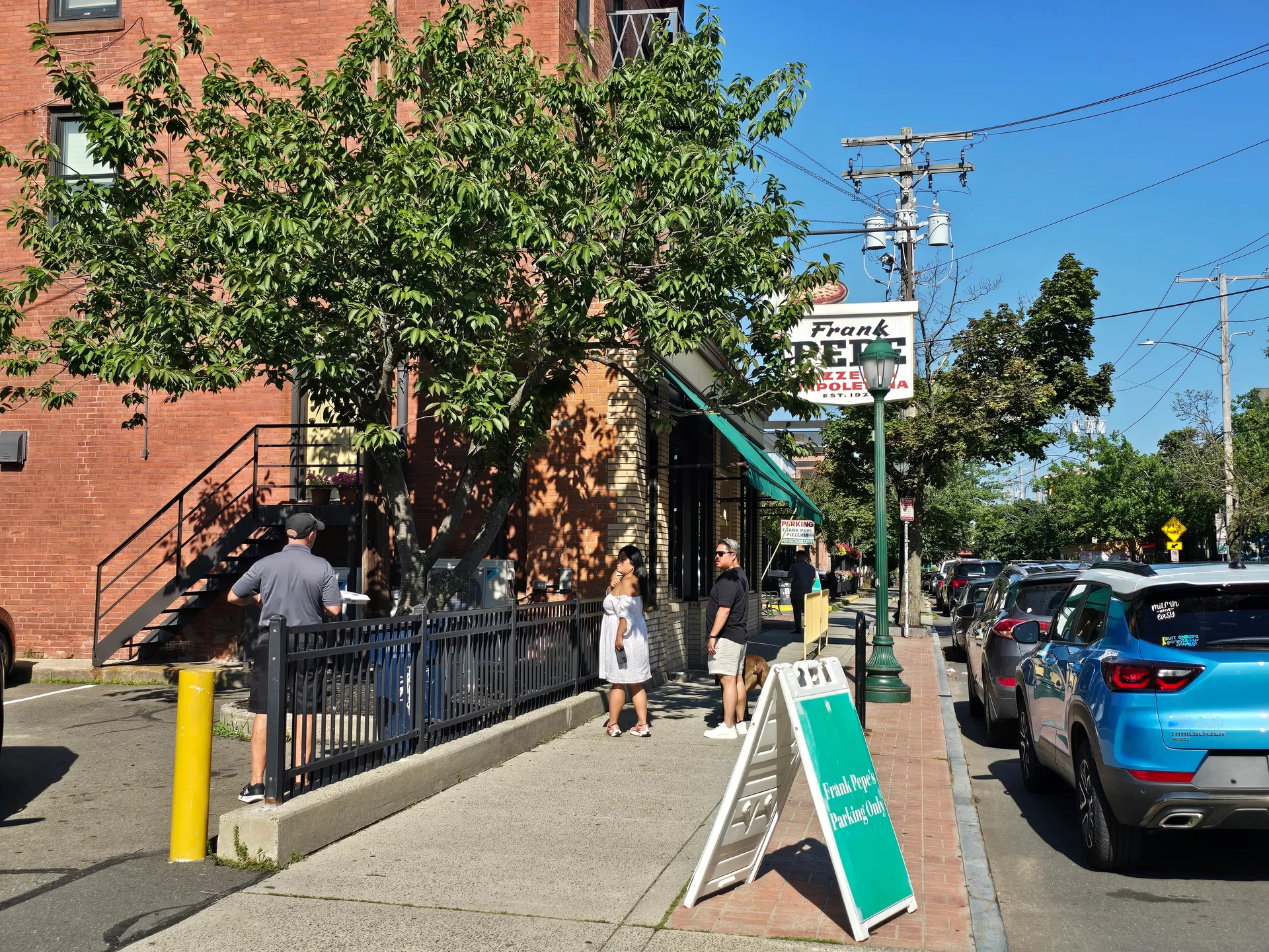 The iconic exterior of Frank Pepe Pizzeria Napoletana on Wooster Street