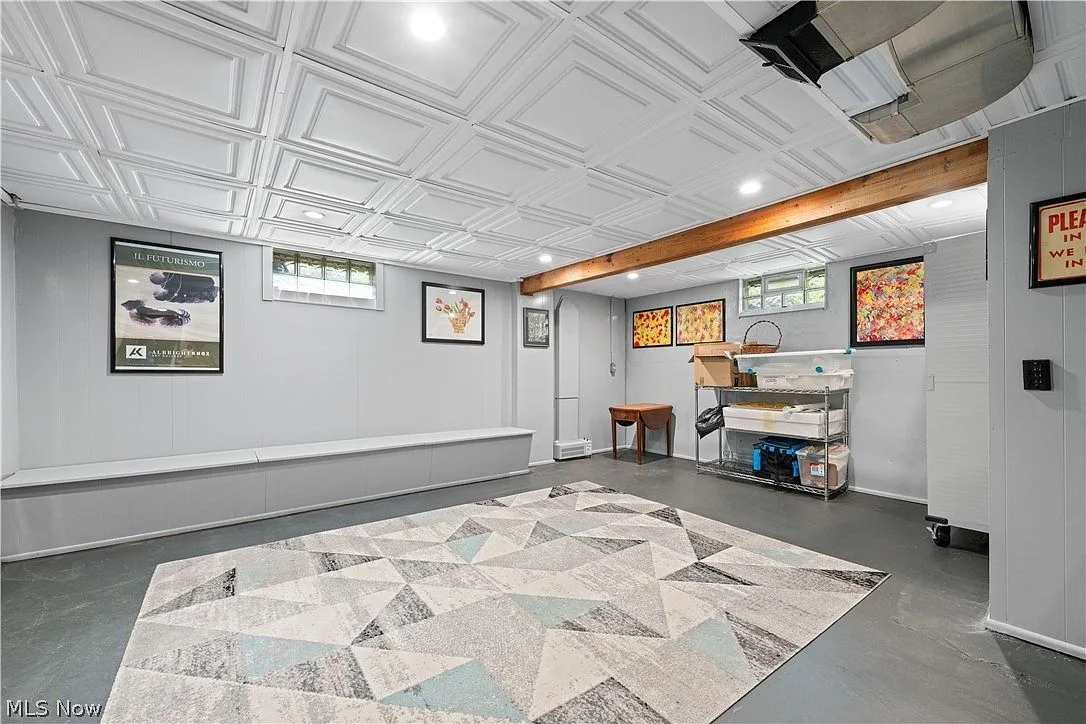 Finished basement recreation room with recessed lighting
