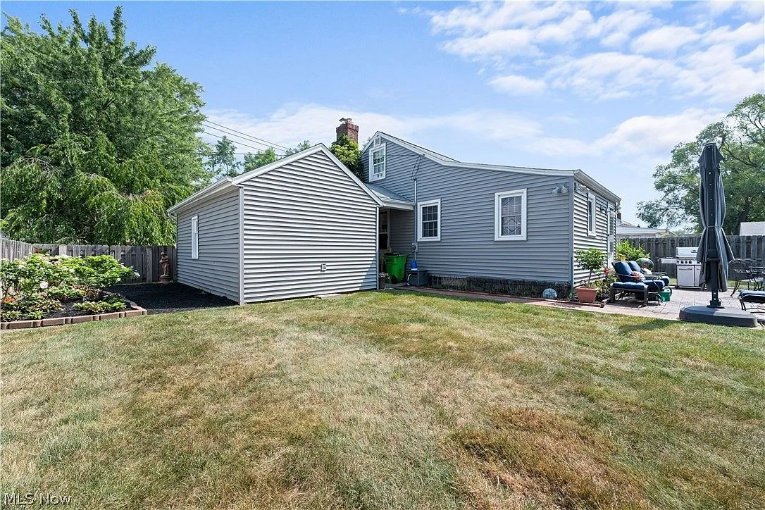 Backyard view looking toward side and rear of house