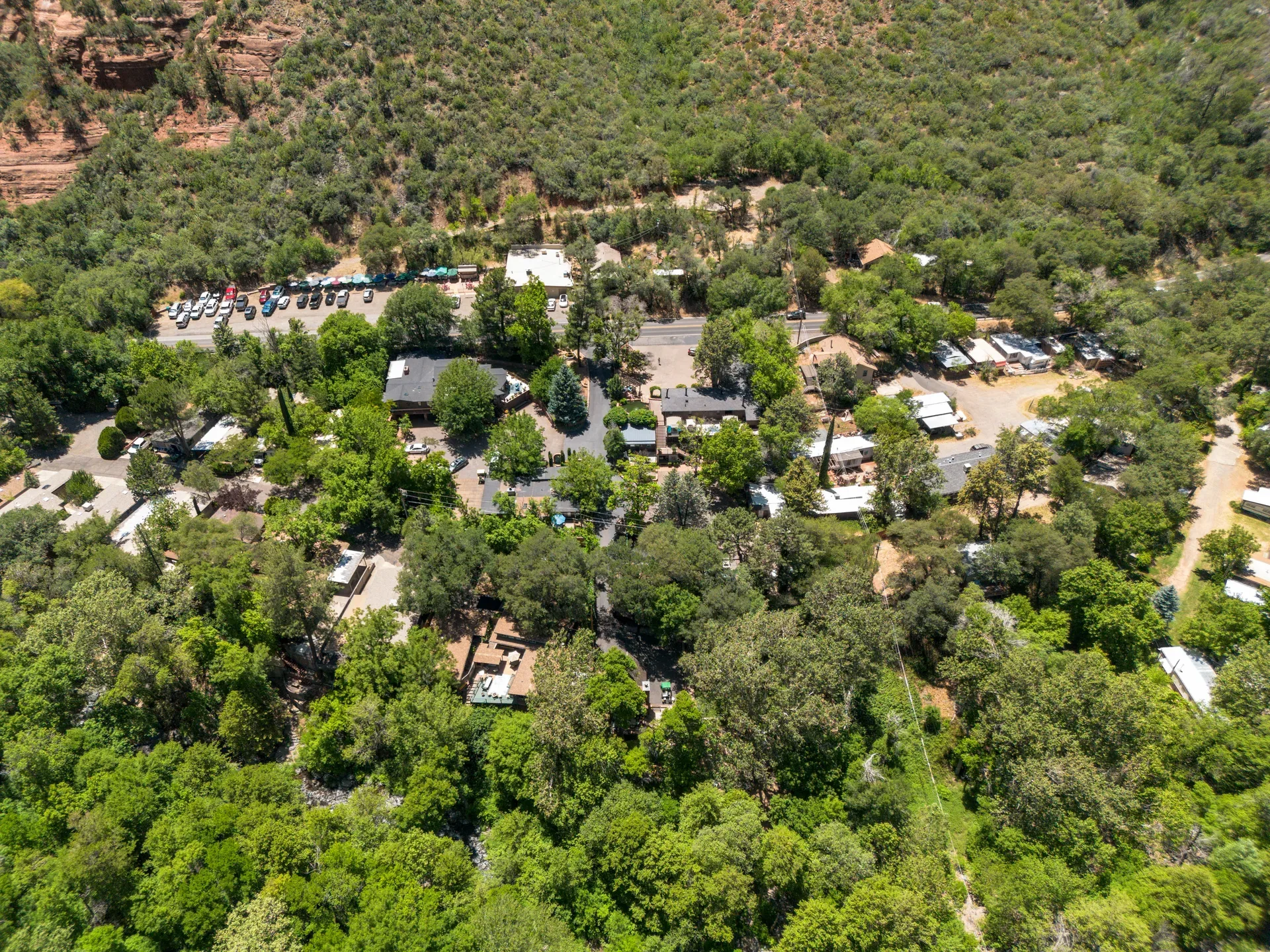 Drone view of Oak Creek Terrace Resort in lush canyon setting