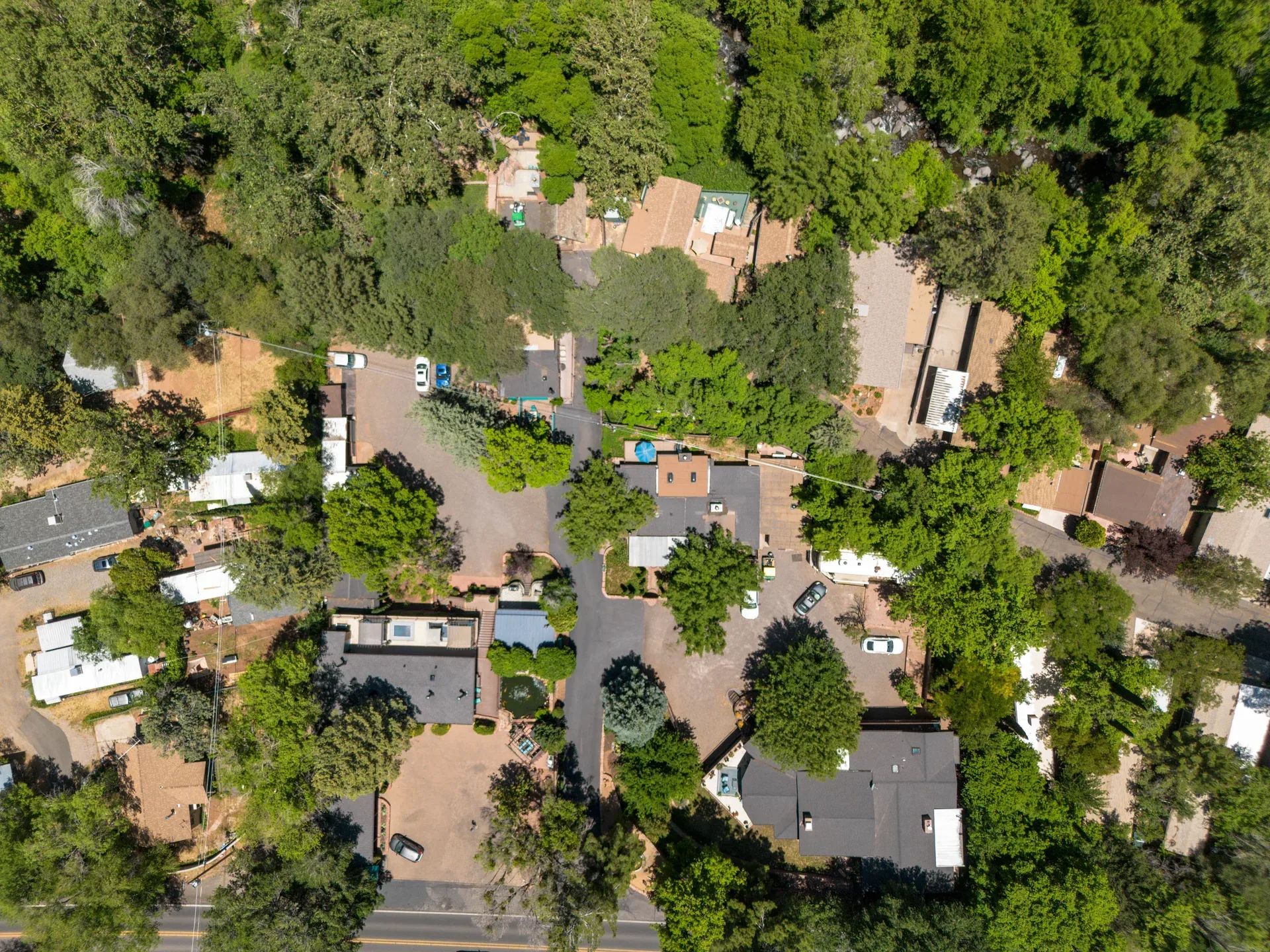 High-altitude aerial shot of resort buildings and landscaped grounds
